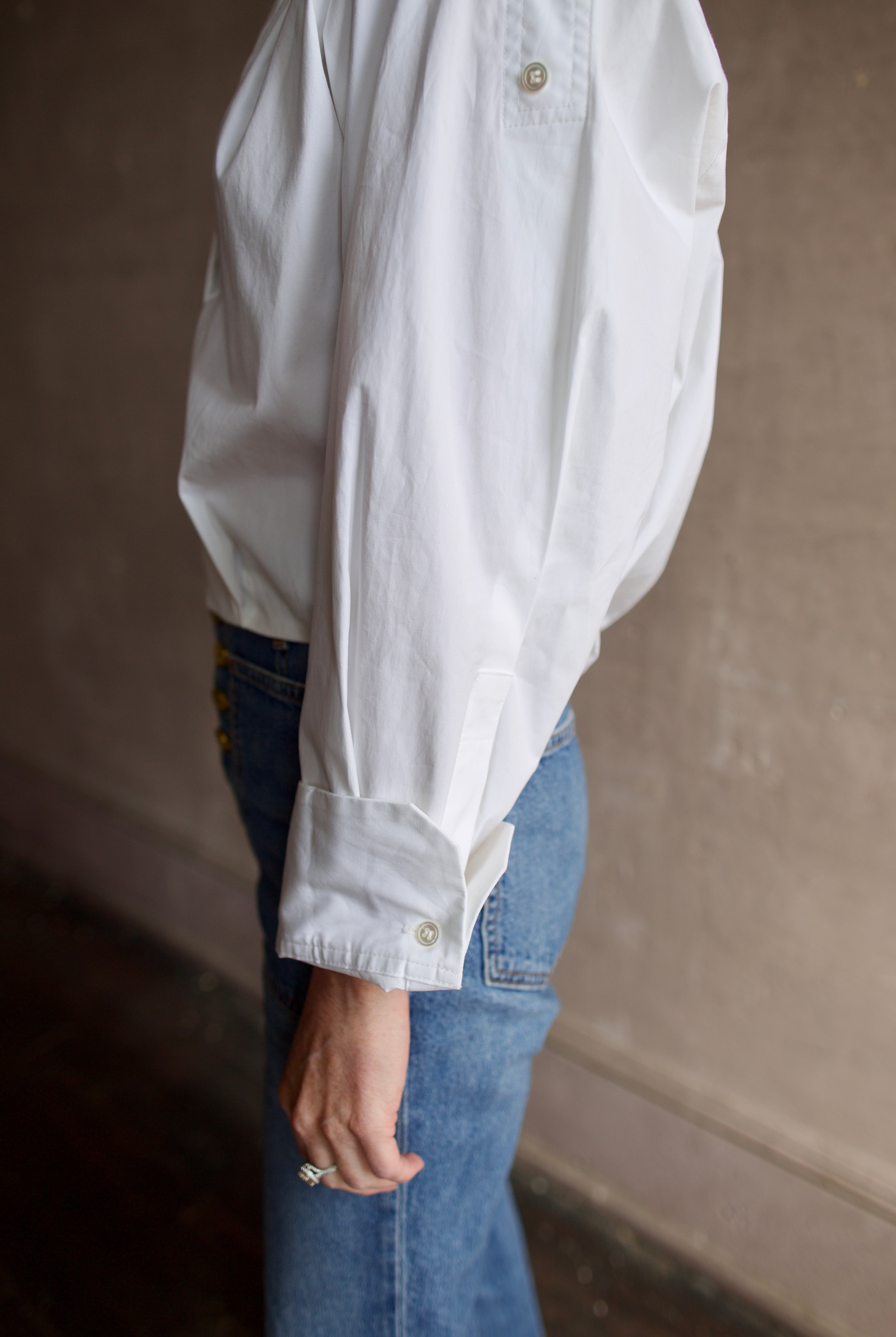 Mature woman wearing A.L.C. Jordan long sleeve white Top in premium cotton blend