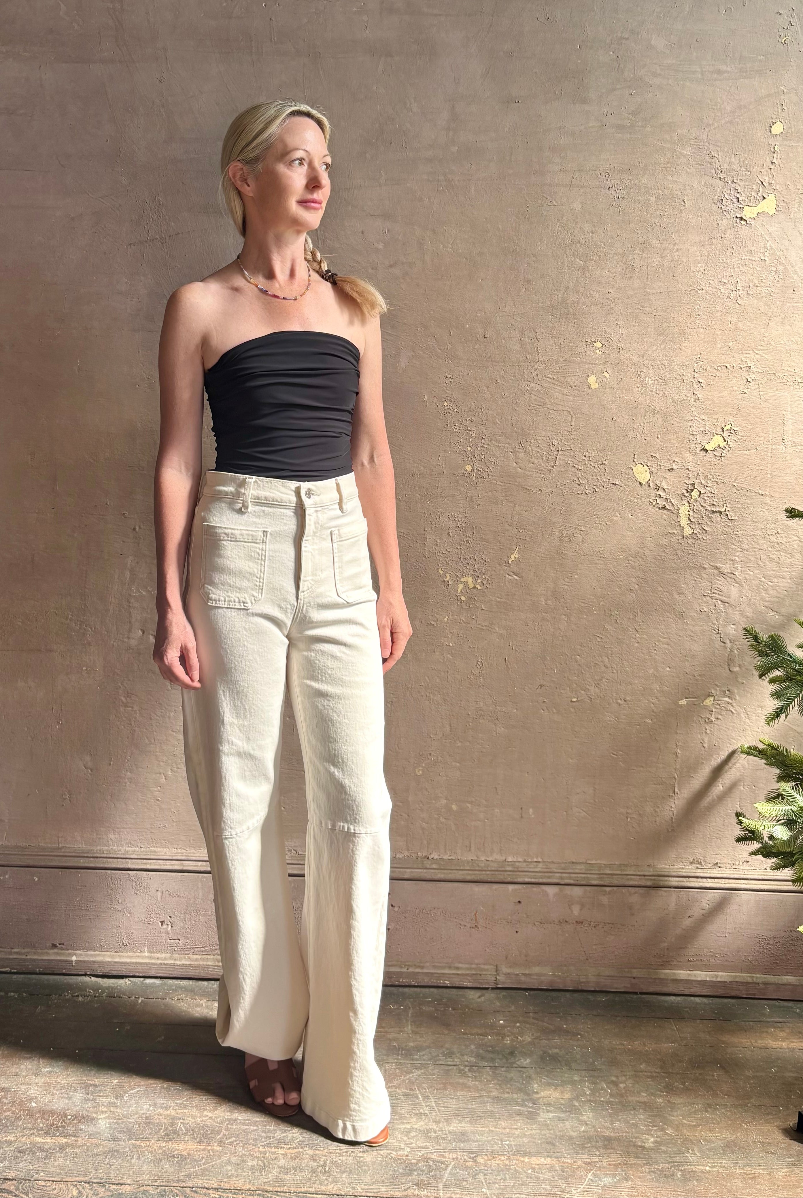 Mature woman wearing AGOLDE Gwyneth Bodysuit in black with premium stretch for timeless versatile styling