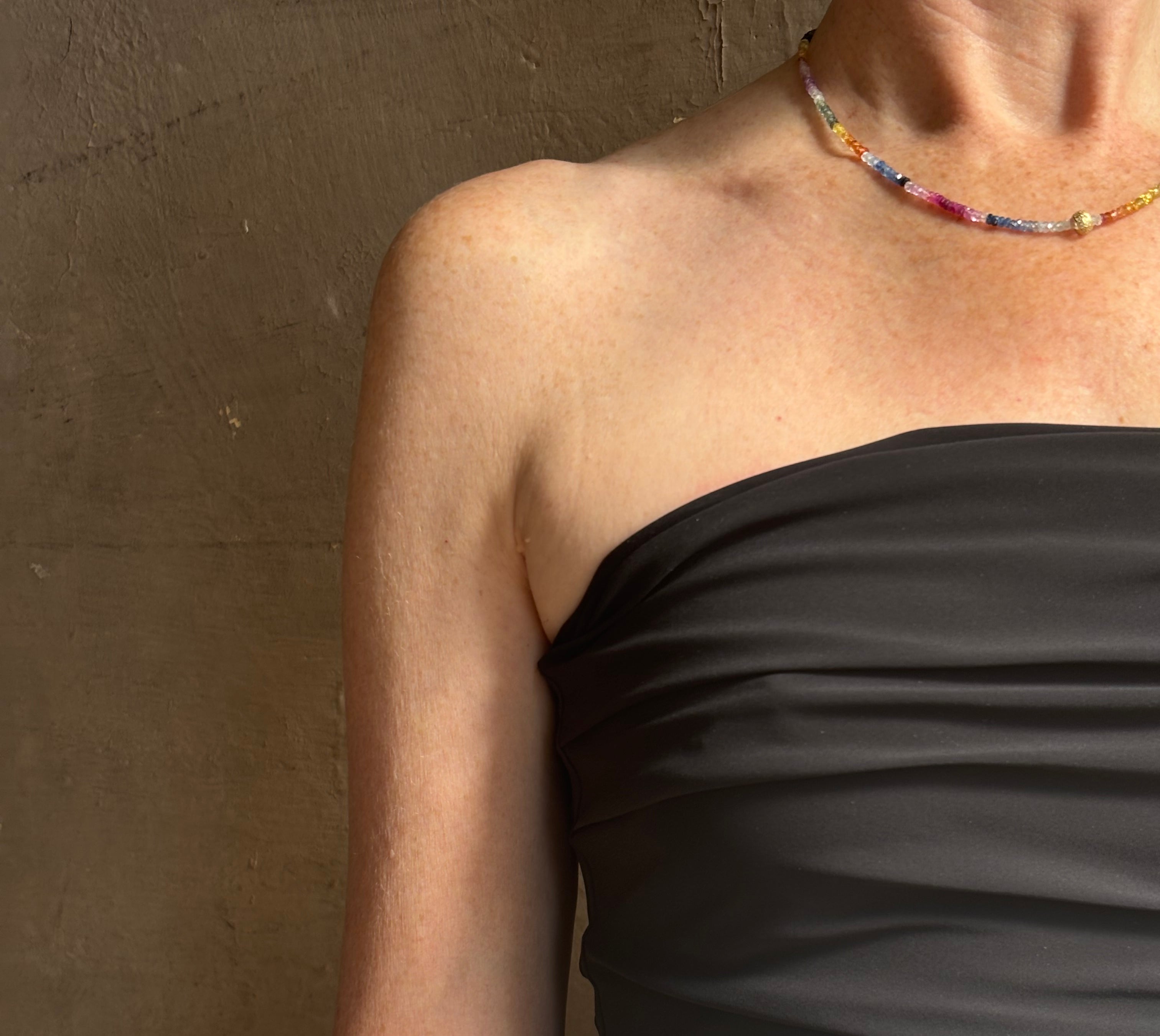 Mature woman wearing AGOLDE Gwyneth Bodysuit in black with premium stretch for timeless versatile styling