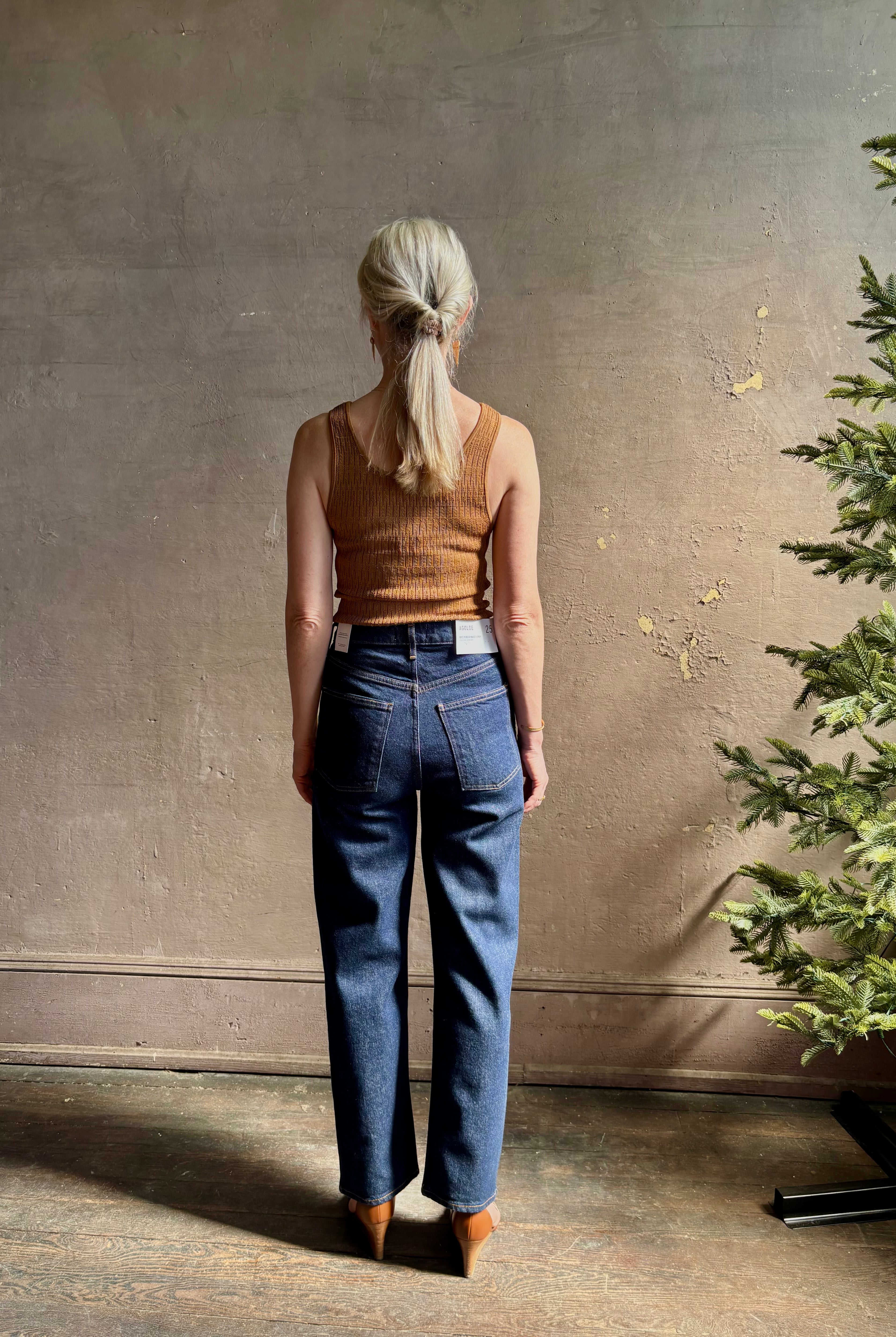 Mature woman wearing Agolde 90's Pinch Waist Crop with regenerative cotton zip closure no distressing