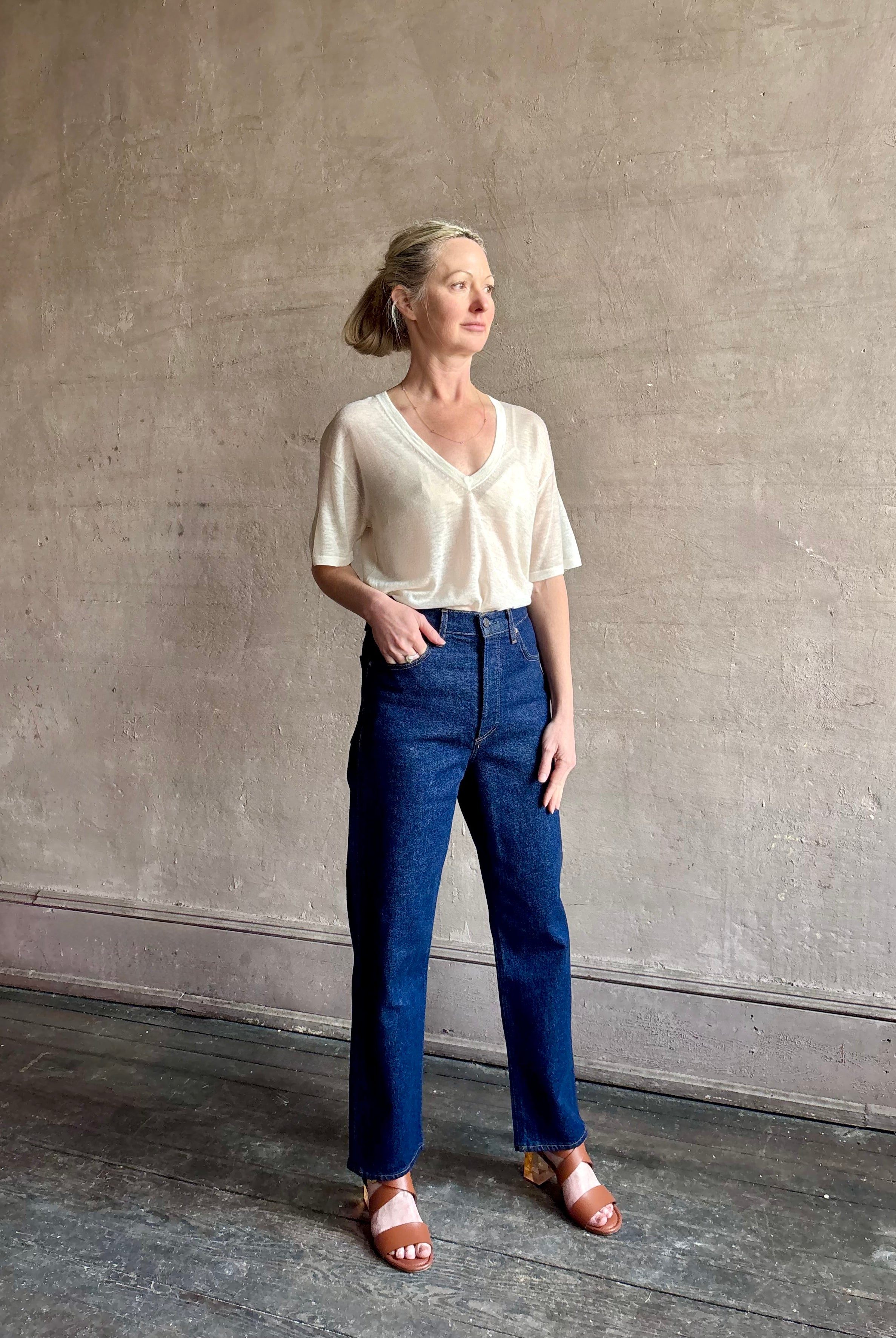 Image of woman wearing premium AGOLDE 90's Pinch Waist Crop in Reissue dark wash with high rise finished hem and slight taper straight leg