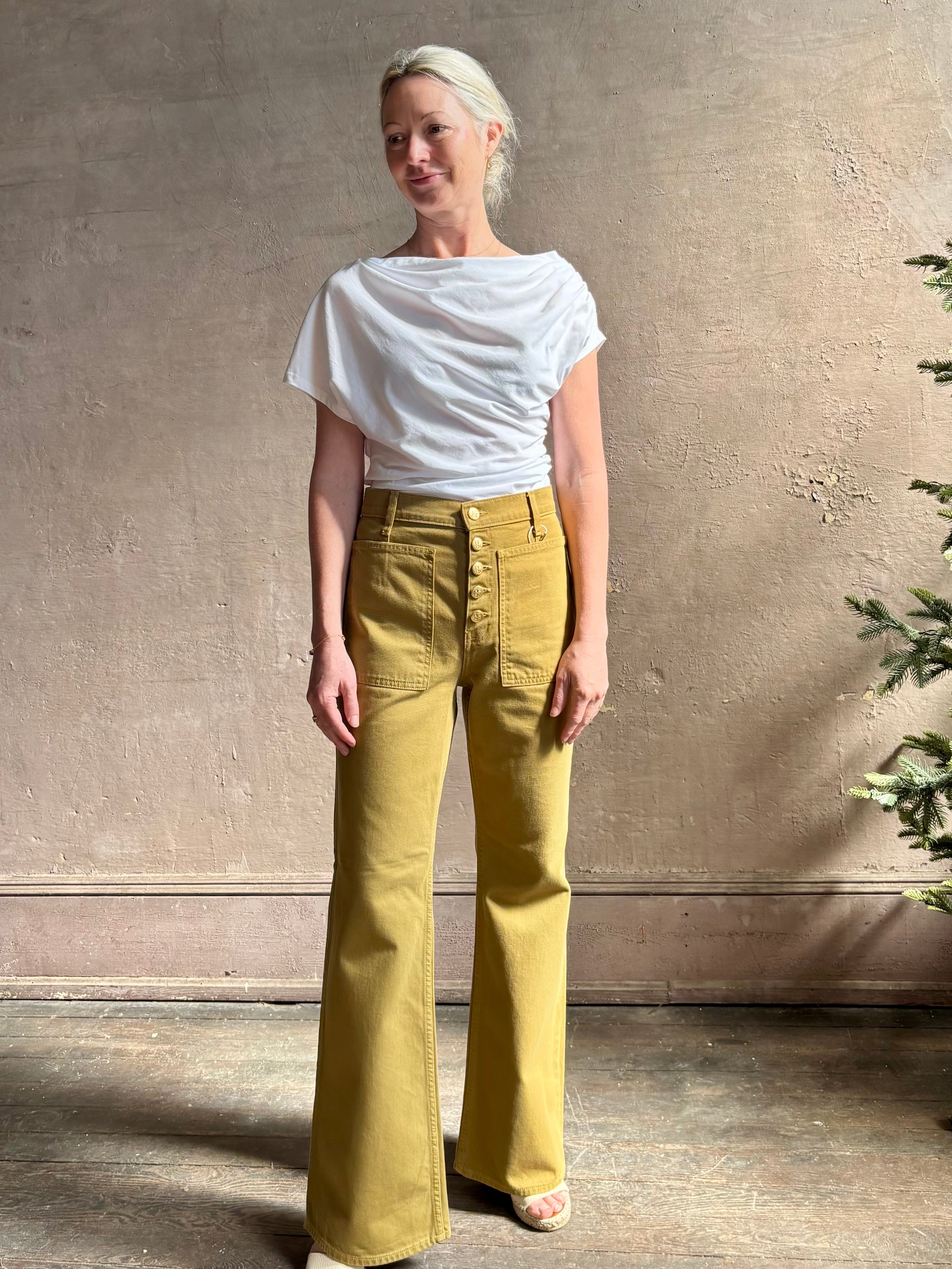 Mature woman wearing ALC Alice cotton t-shirt with ruched side and shoulder detail that can be worn asymmetrically in bright white