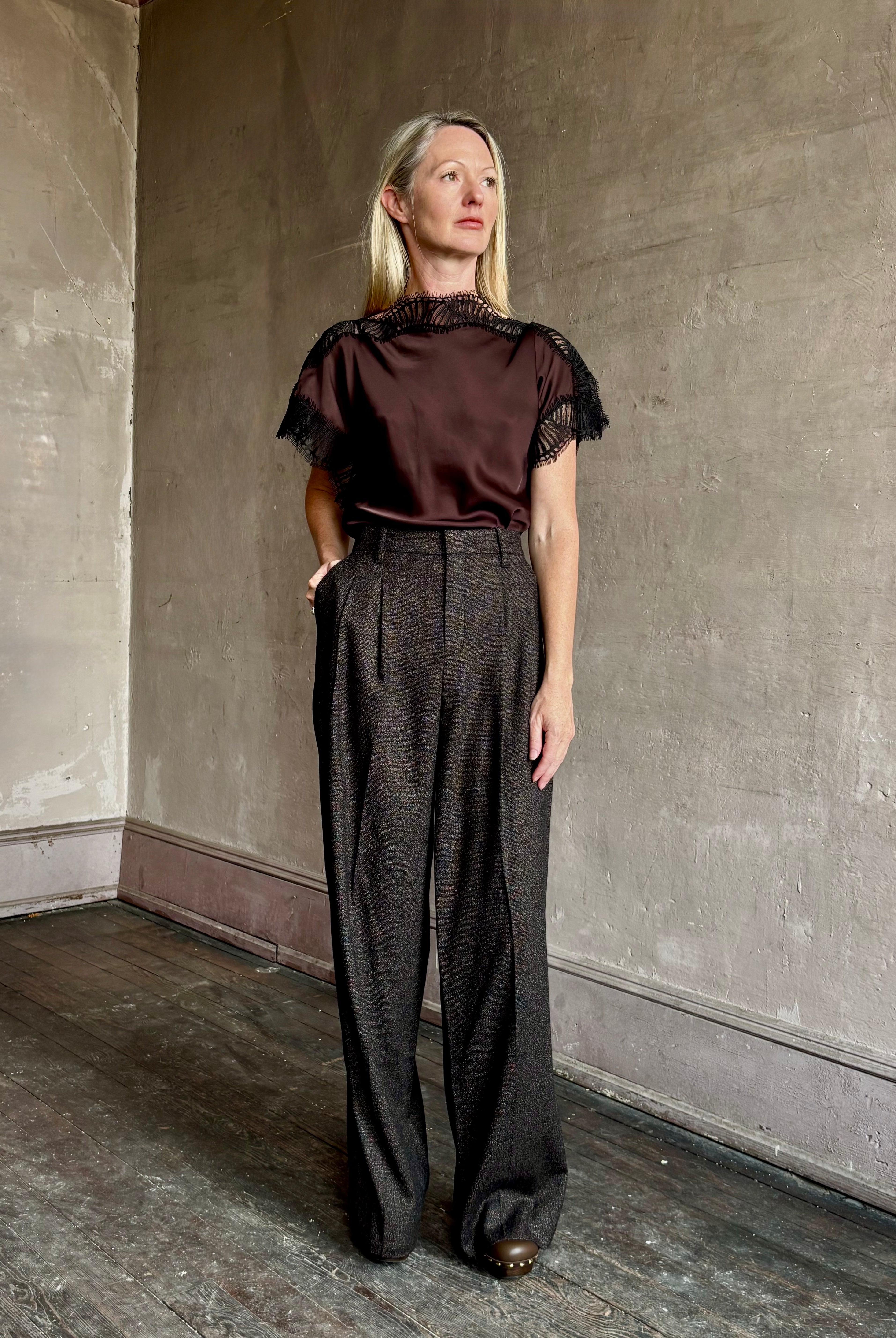 Image of mature woman wearing ALC Luna top in premium chocolate brown viscose blouse with a boat neck short sleeve and refined black lace trim