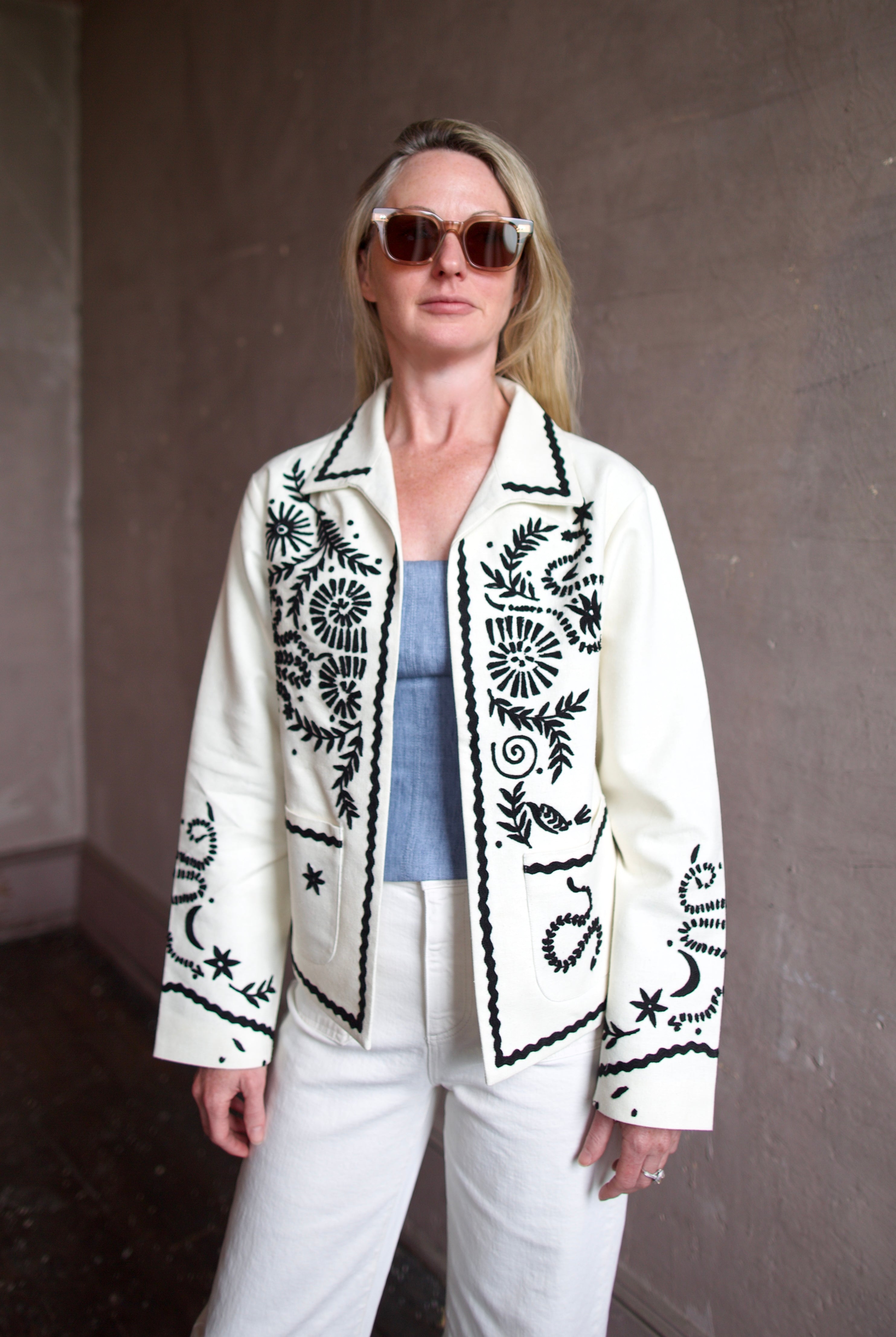 Mature woman wearing the Alix of Bohemia Francis Bone Snake Jacket in black and white colorway with luxury 100% silk fabric and Bohemian refinement