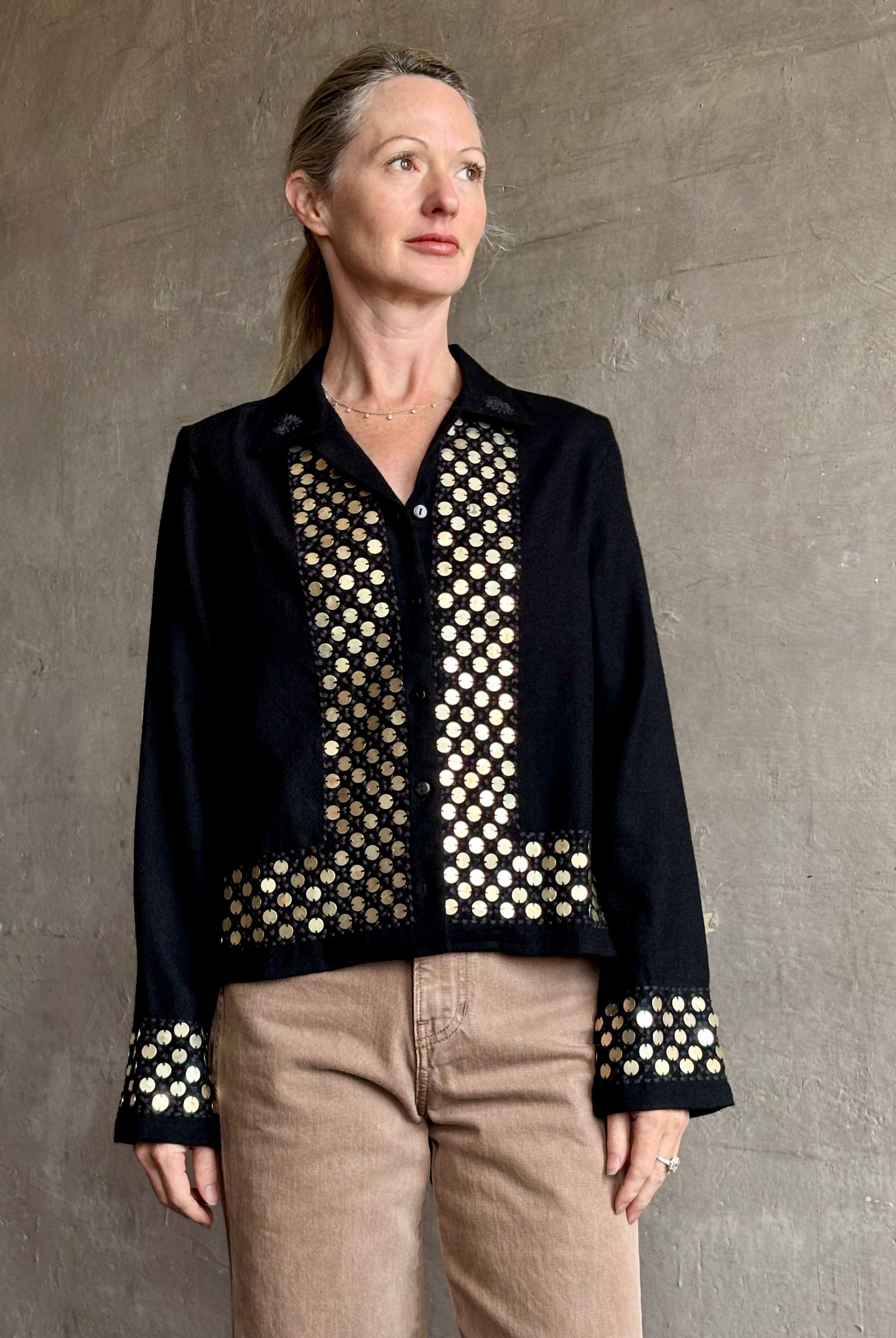 Image of woman wearing Alix of Bohemia premium wool Pippa Spur button down Shirt with brass coin embellishments down front, bottom and sleeves