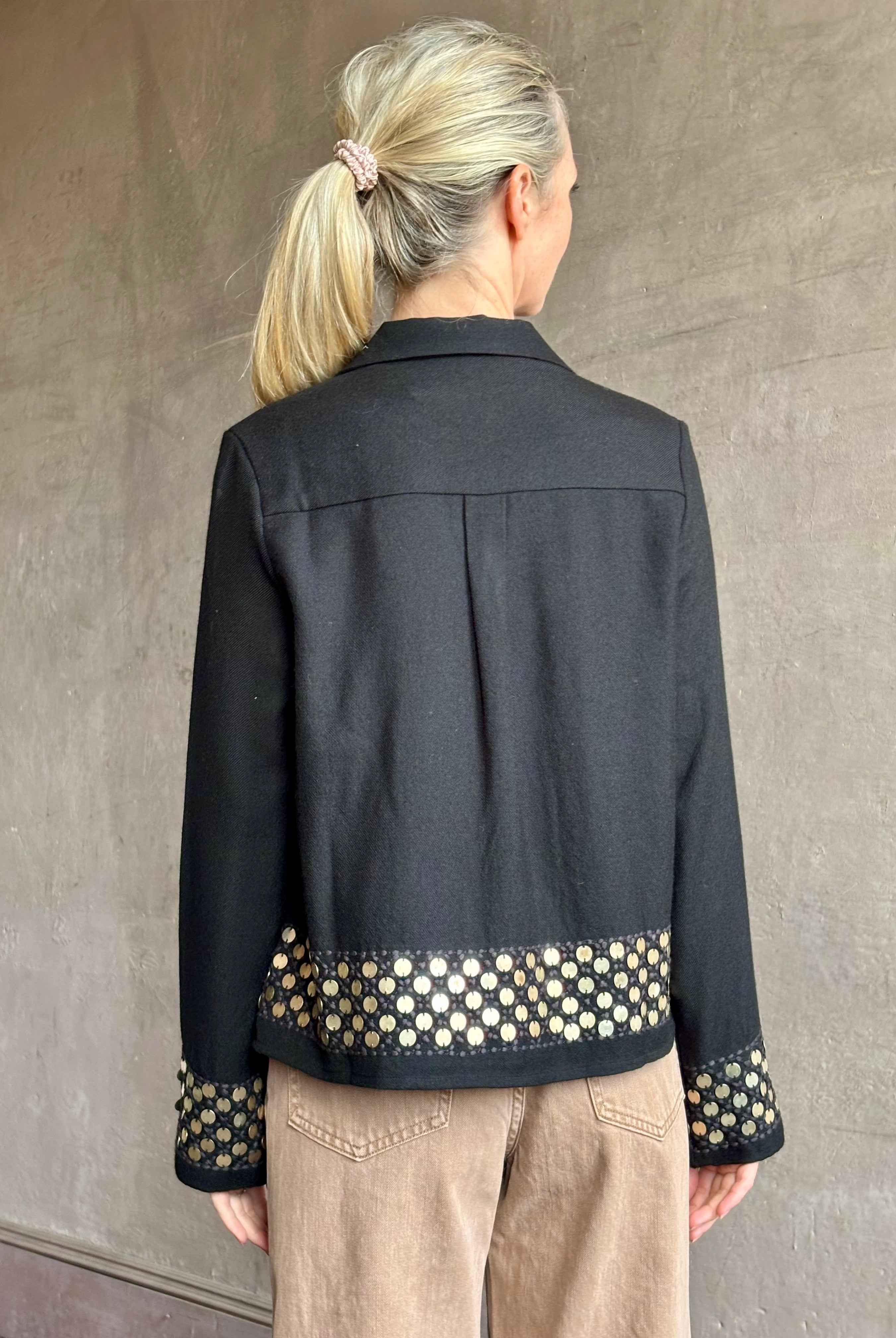 Image of woman wearing Alix of Bohemia premium wool Pippa Spur button down black Shirt with brass coin embellishments long sleeves and collar