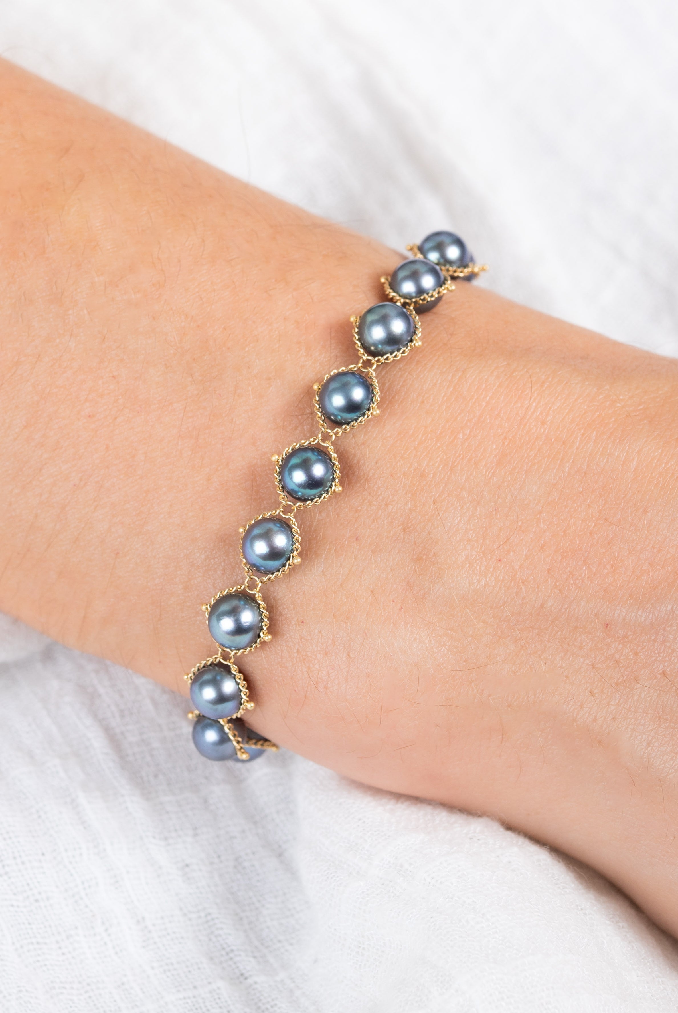 The Blue Akoya Pearl Bracelet from Amali fine jewelry piece that celebrates the rare beauty of blue Akoya pearls in refined 18K gold setting and handcrafted in New York