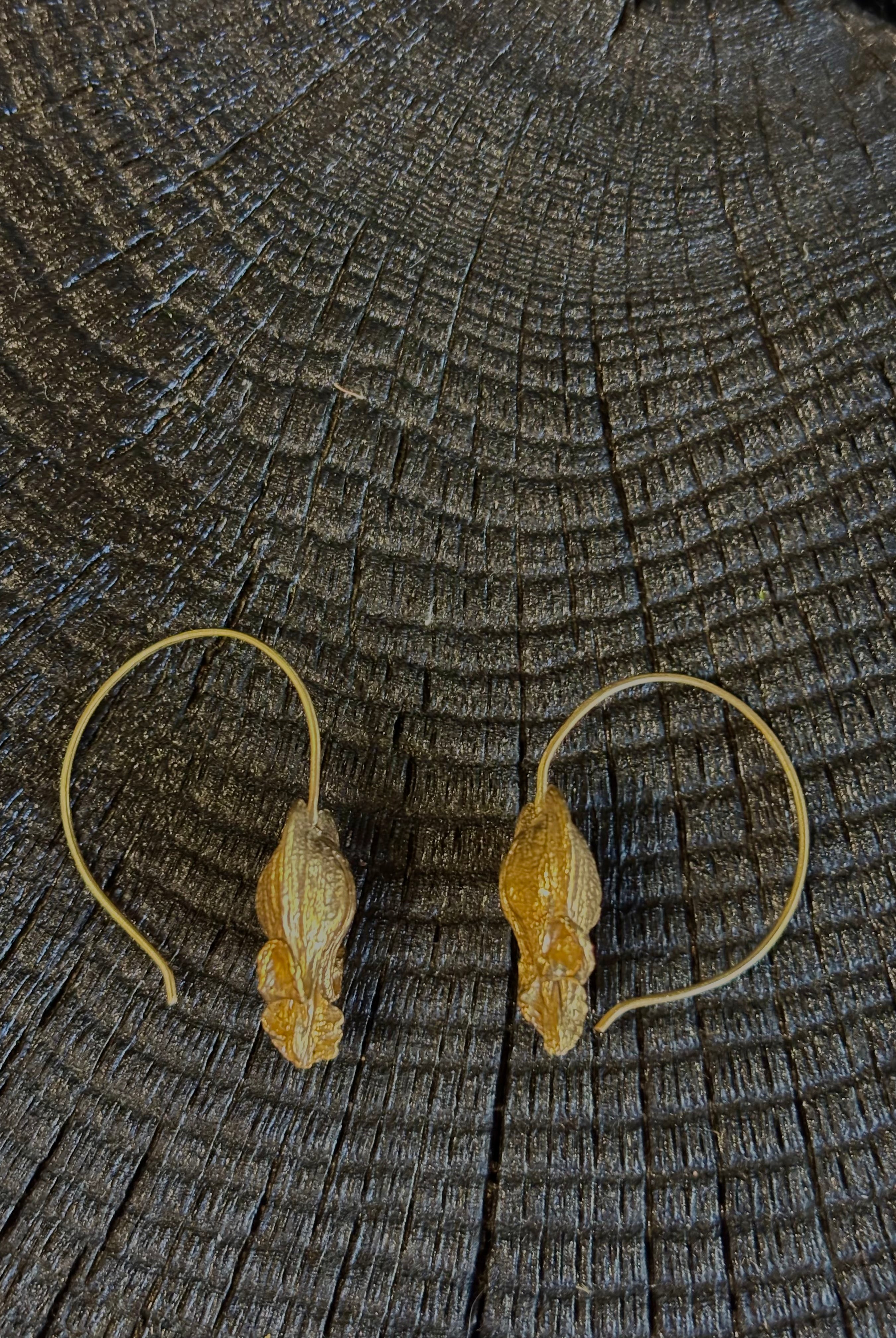 Image of Bleeding Heart Hoop Earrings from North Carolina fine Jewelry artist Amber Mahler handcrafted 18K yellow gold vermeil botanical casting.