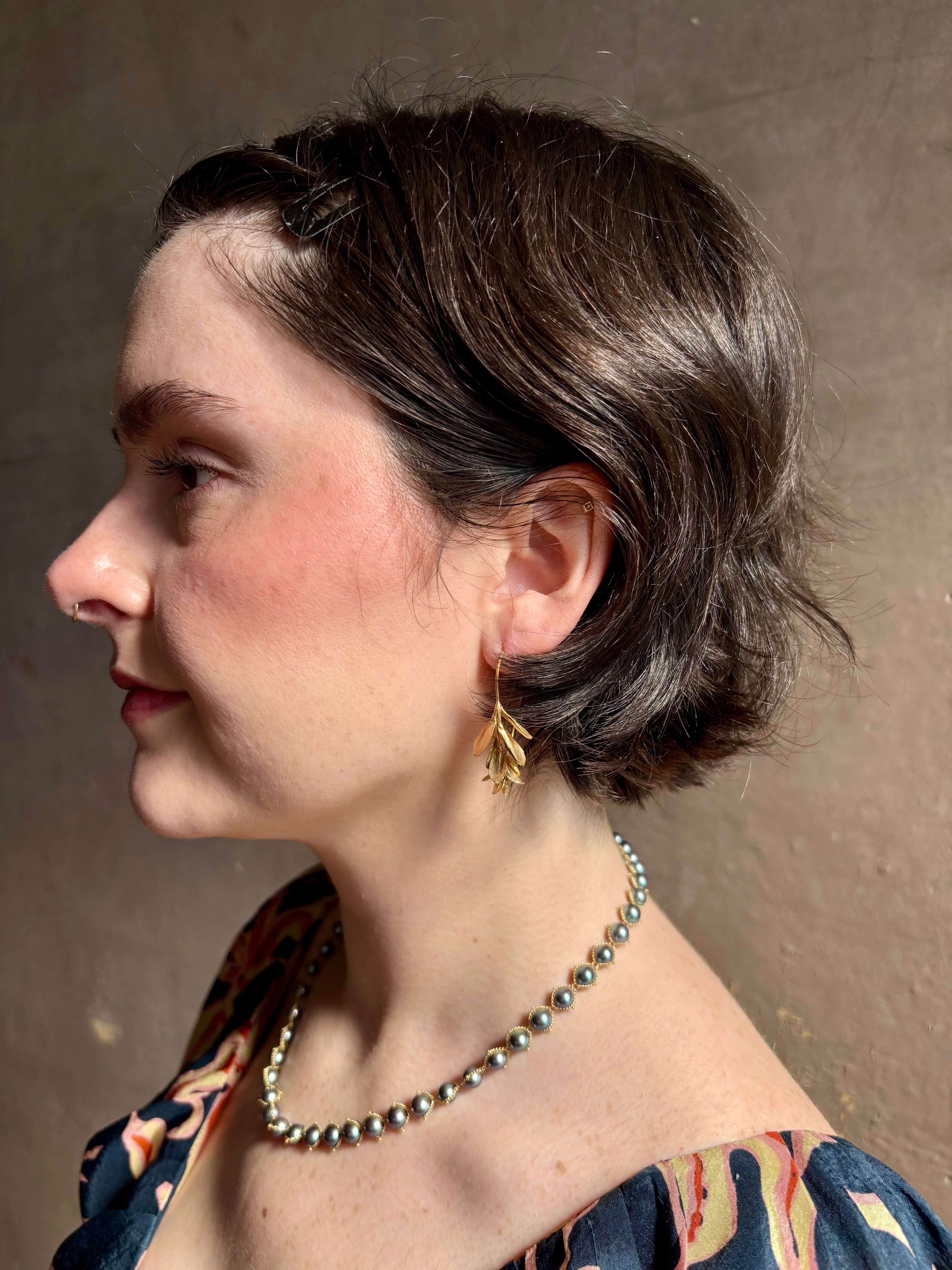 Woman wearing Large Succulent Drop Earrings from North Carolina fine jewelry artist Amber Mahler exquisitely handcrafted 18K yellow gold vermeil botanical casting
