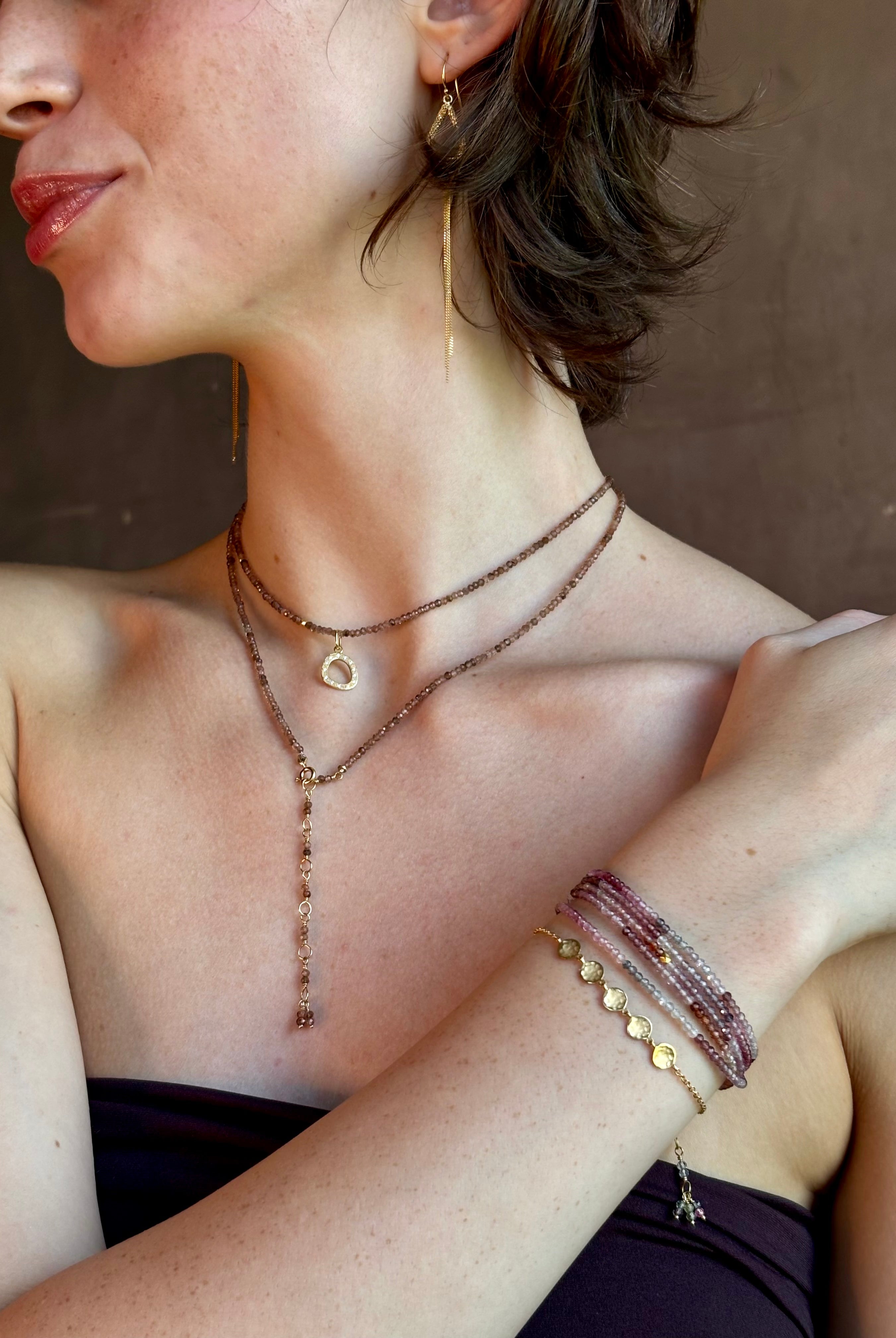 delicate 18K yellow gold bracelet by fine jewelry artist Anne Sportun handcrafted with 5 hammered gold discs