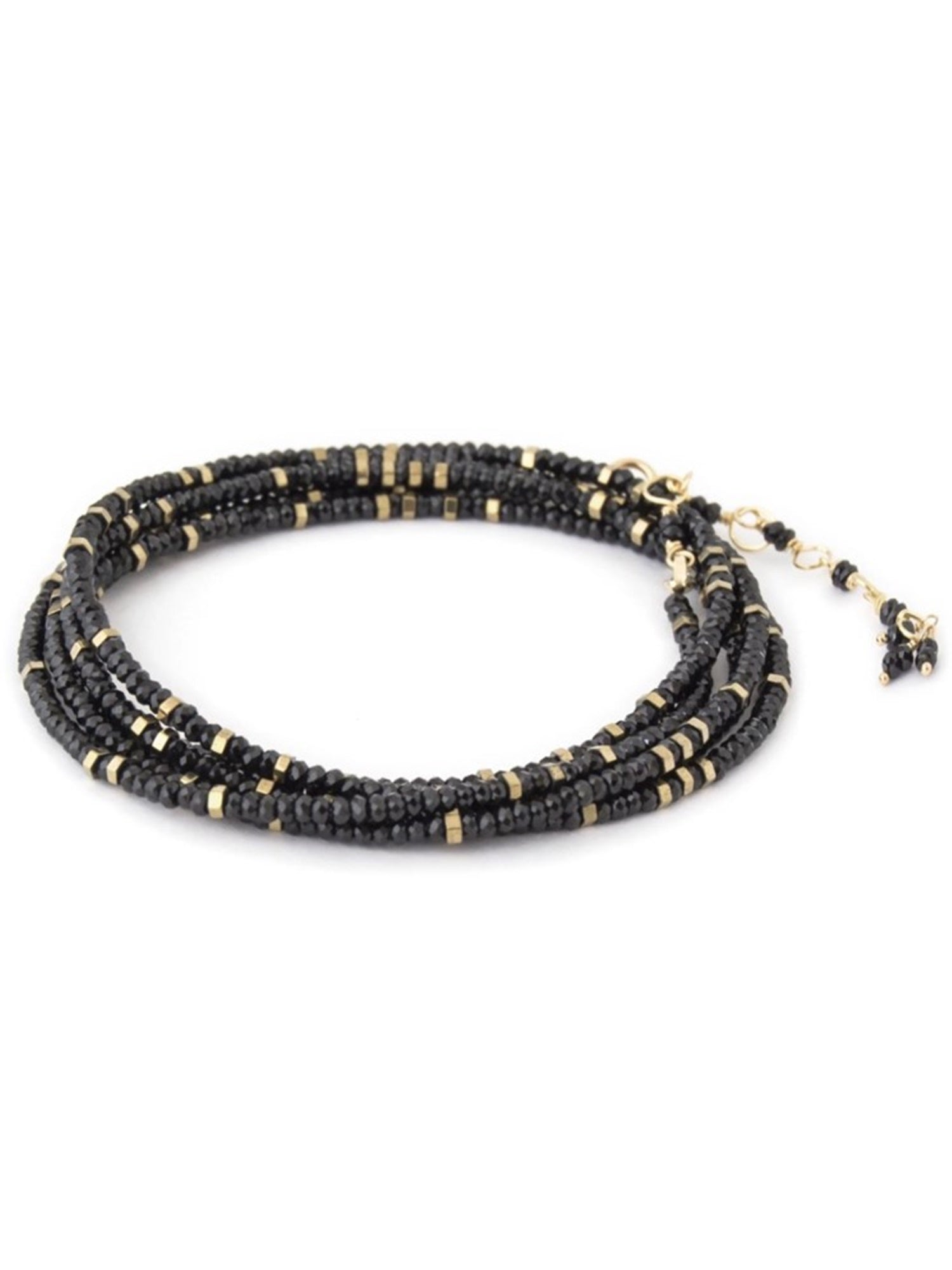 Woman wearing spinel confetti wrap Bracelet from Canadian fine jewelry artist Anne Sportun with natural stone spinel and 18k yellow gold beads that can double as a necklace perfect for travel