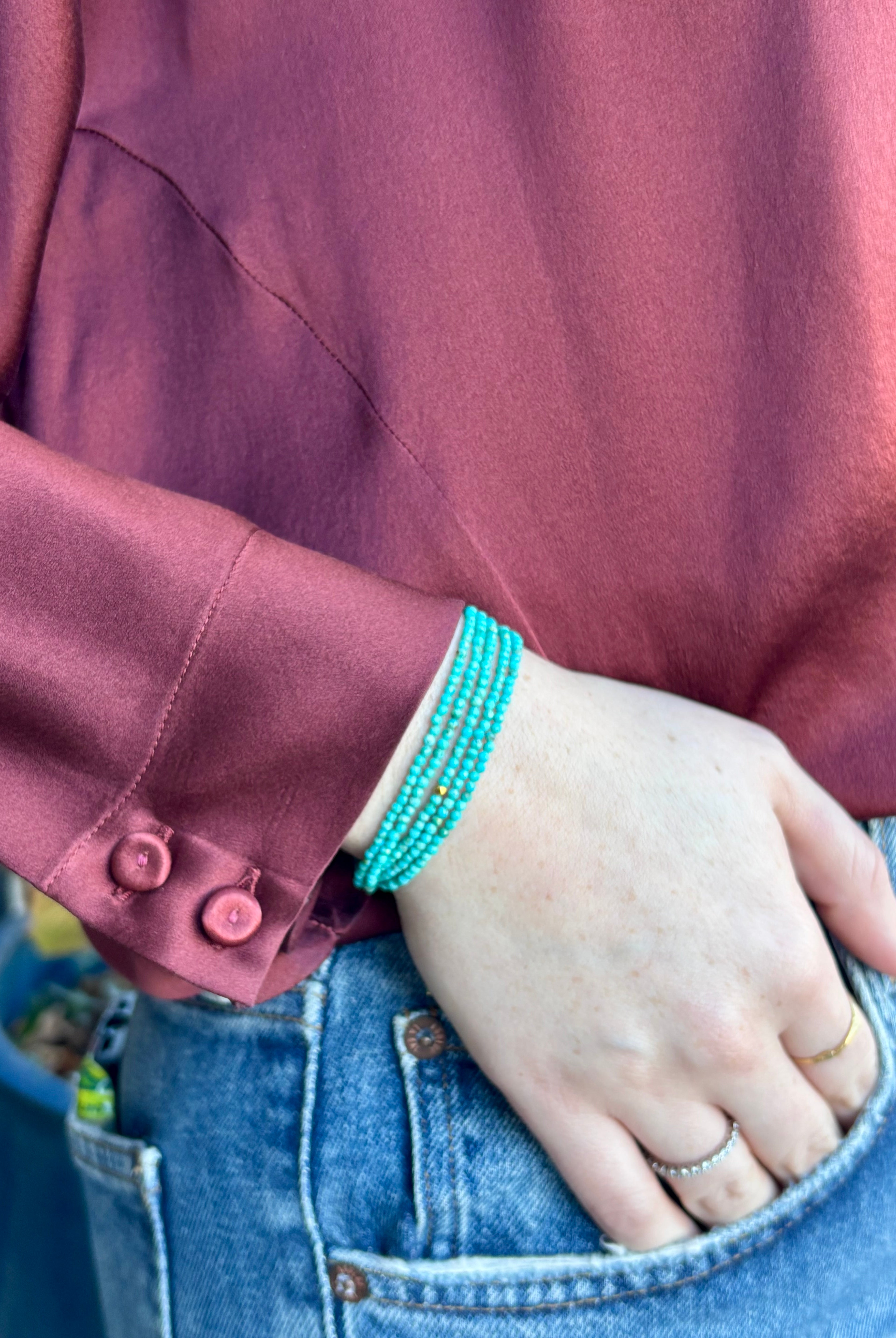 Image of woman wearing Canadian Jewelry designer ANNE SPORTUN Turquoise Wrap Bracelet in 18K Yellow Gold