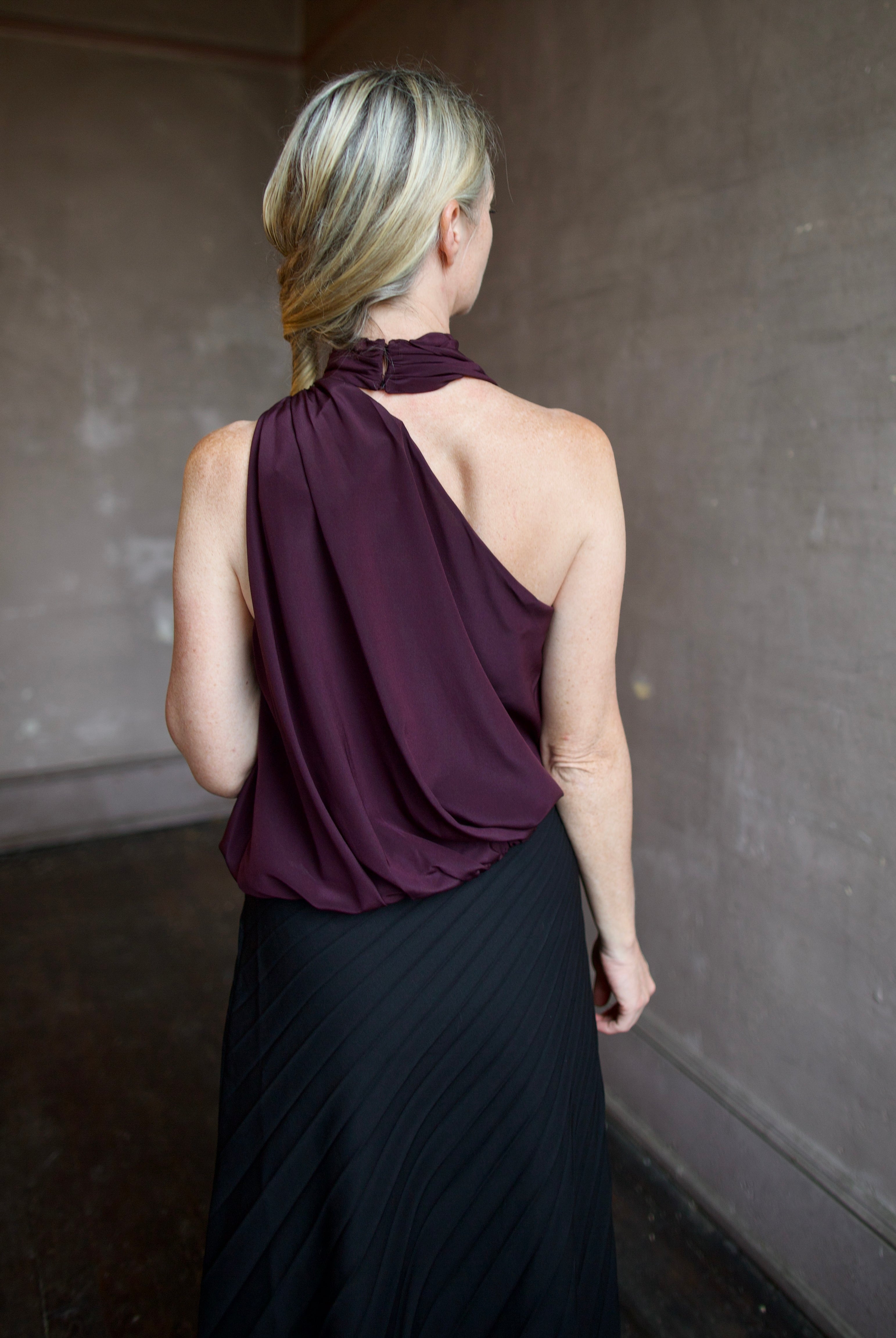 Image featuring back of the silk asymmetrical celeste top by ALC for a sophisticated date night