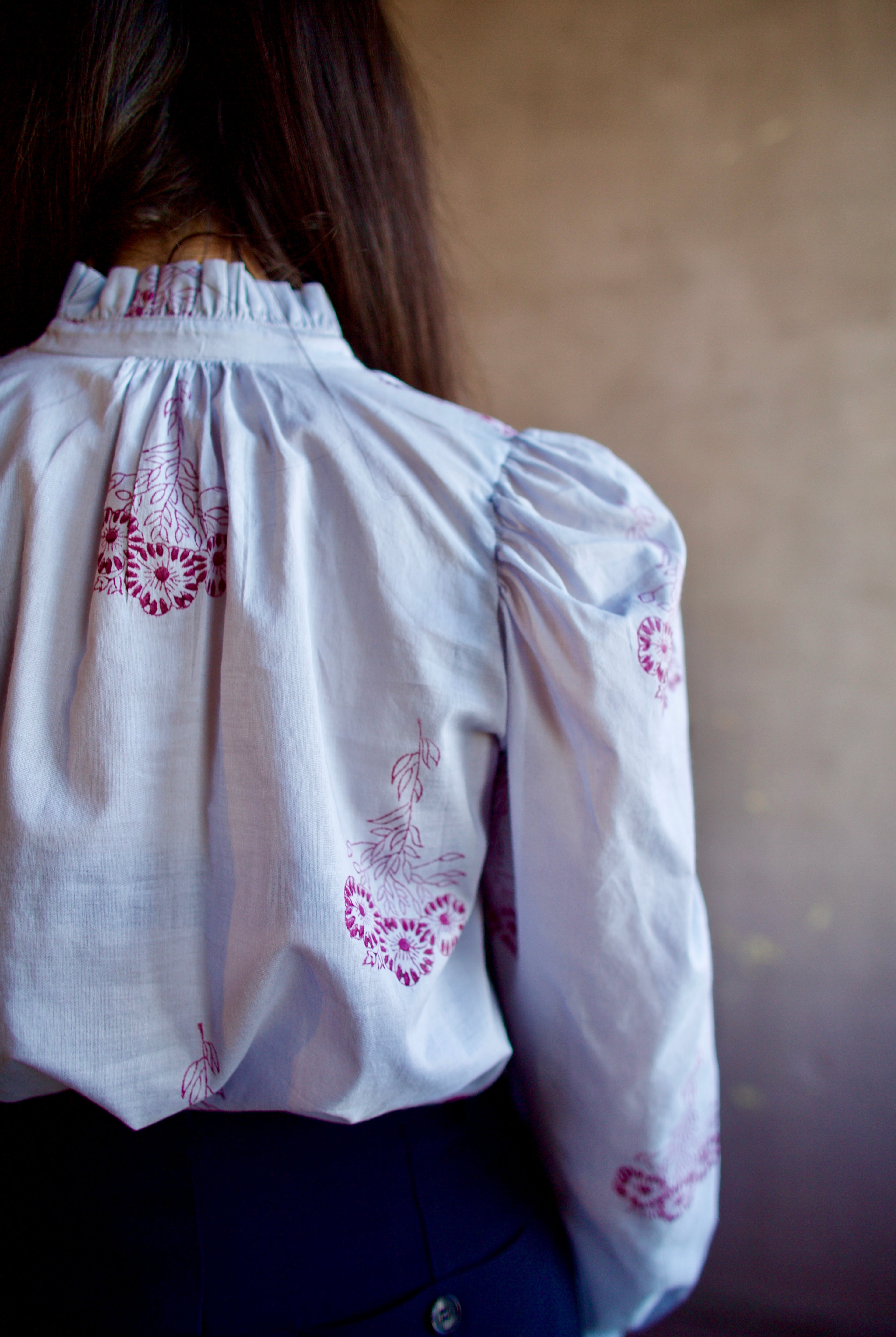 Woman wearing the alix of bohemia annabel pansy sky long sleeve cotton shirt expert handcrafted artistry perfect for elevated casual wear