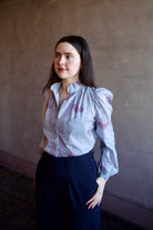 Woman wearing the alix of bohemia annabel pansy sky long sleeve cotton shirt expert handcrafted artistry perfect for elevated casual wear