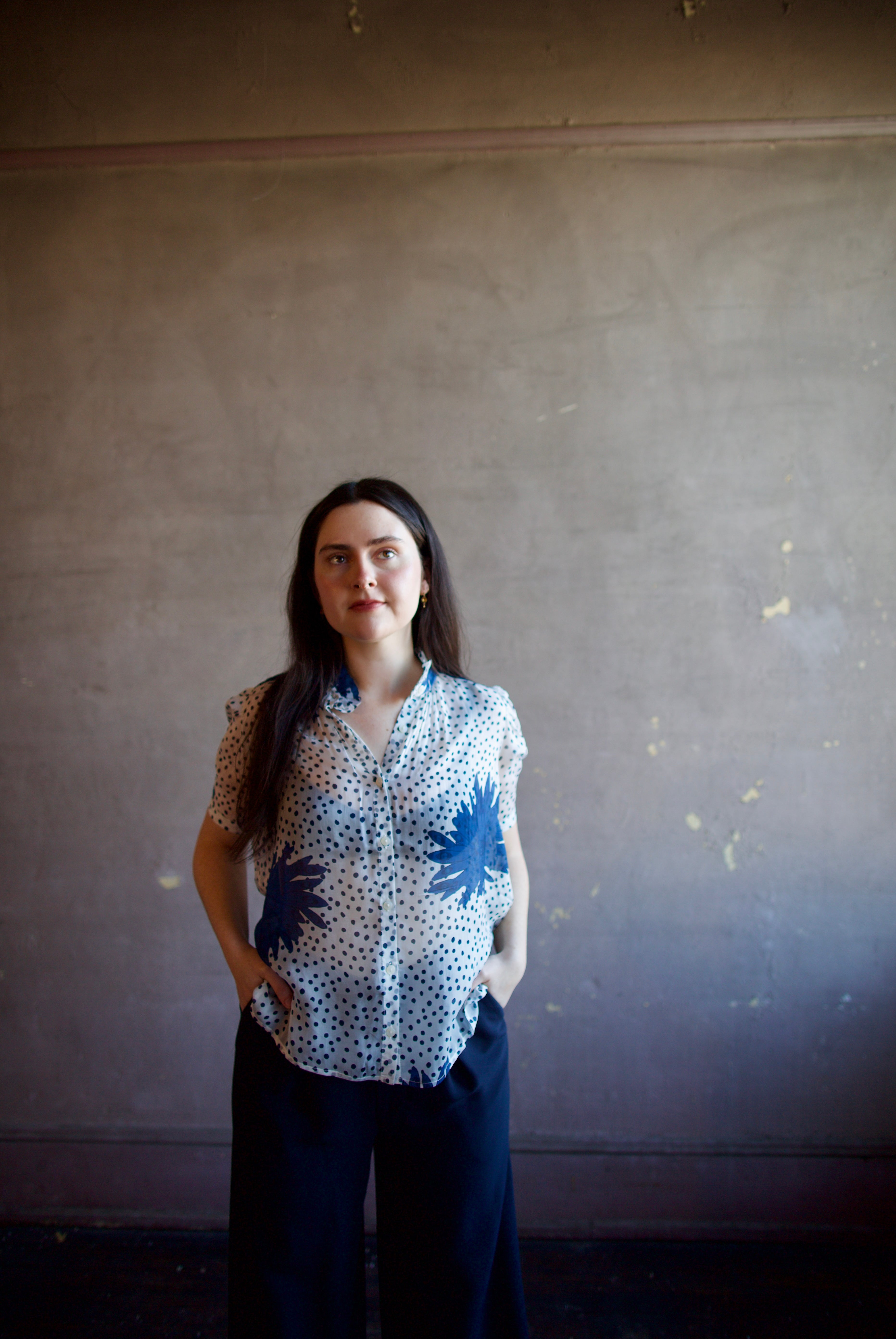 Image of woman wearing luxury alix of bohemia winn indigo dahlia sheer silk shirt featuring an elevated button front with expert handcrafted artistry