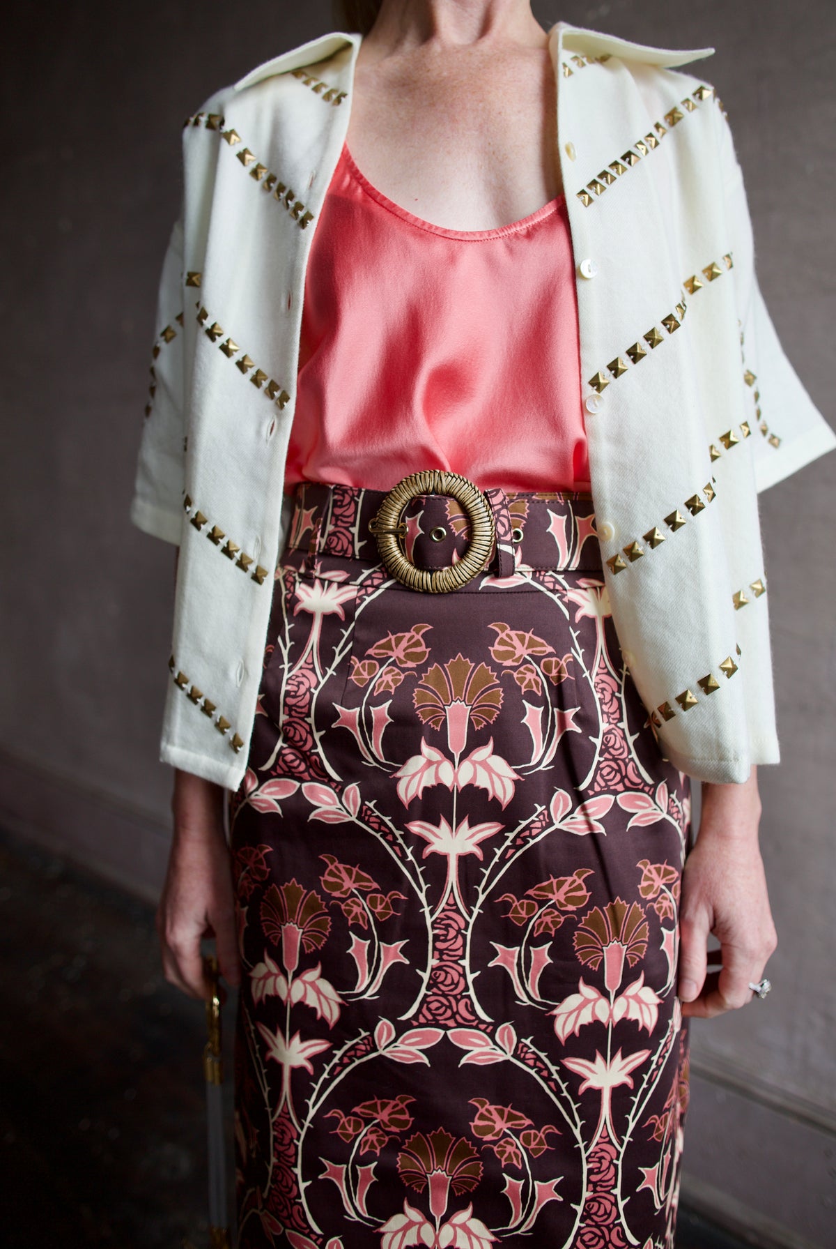 Mature woman wearing Alix of Bohemia Stevie Studded top as a layering shirt with tank top for additional warmth and luxe look