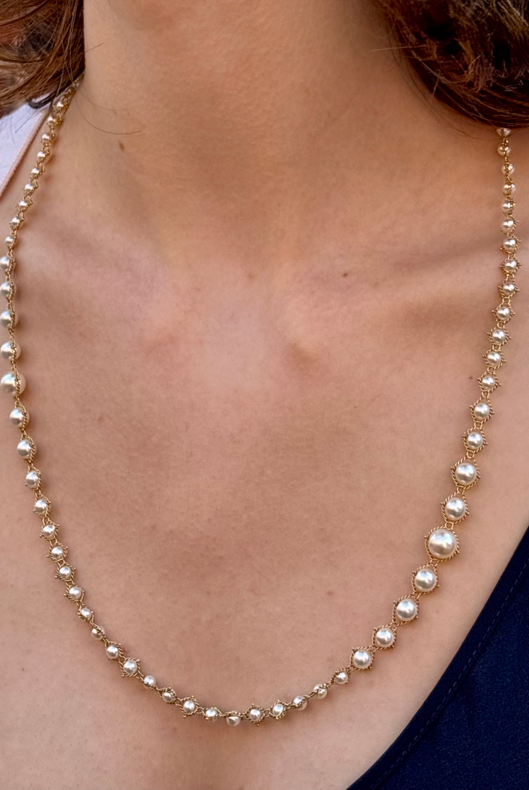 Woman wearing luxury designer Amali hand woven long Akoya Pearl and 18k yellow gold Necklace made in USA fine jewelry