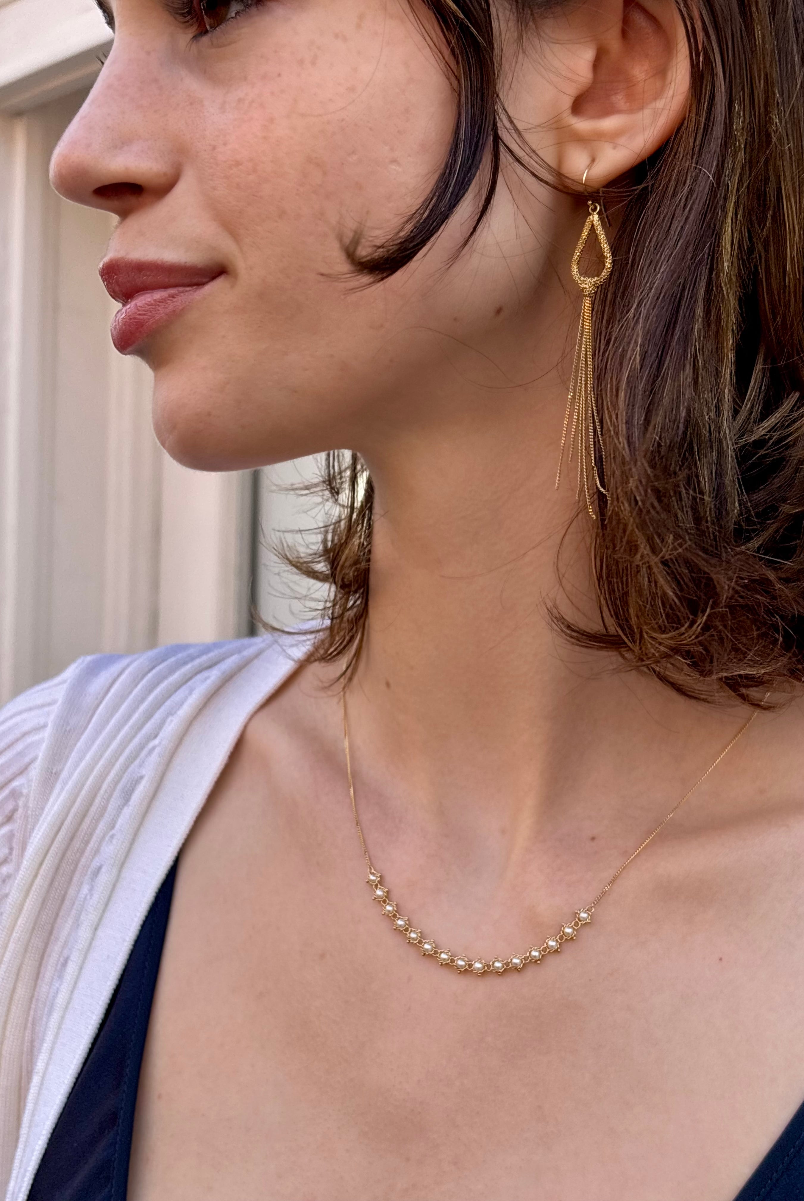 Woman wearing luxury designer Amali freshwater Pearl and 18k yellow gold Necklace fine jewelry handmade in USA