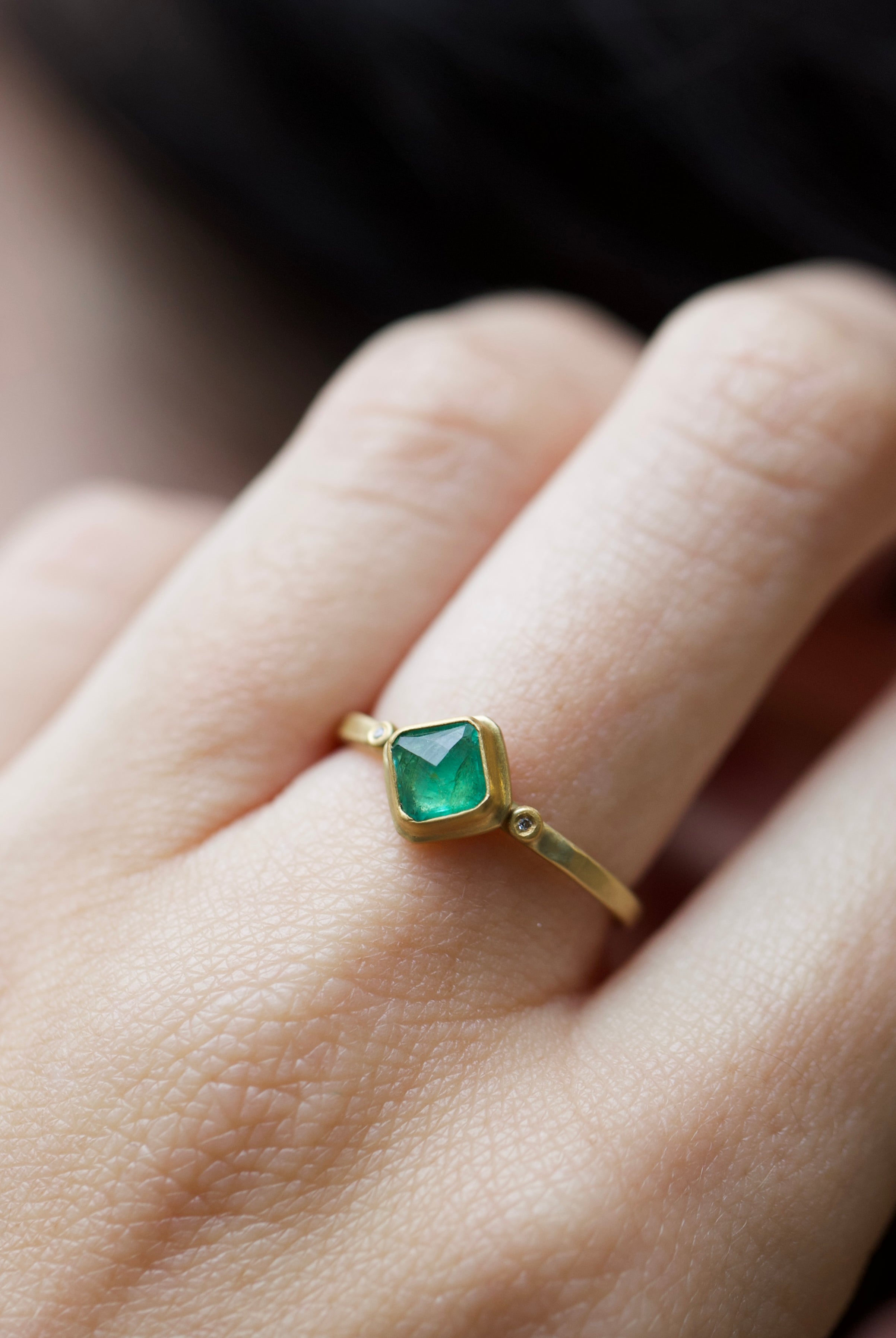 Image of a woman wearing the Ananda Khalsa Rosecut Emerald Ring