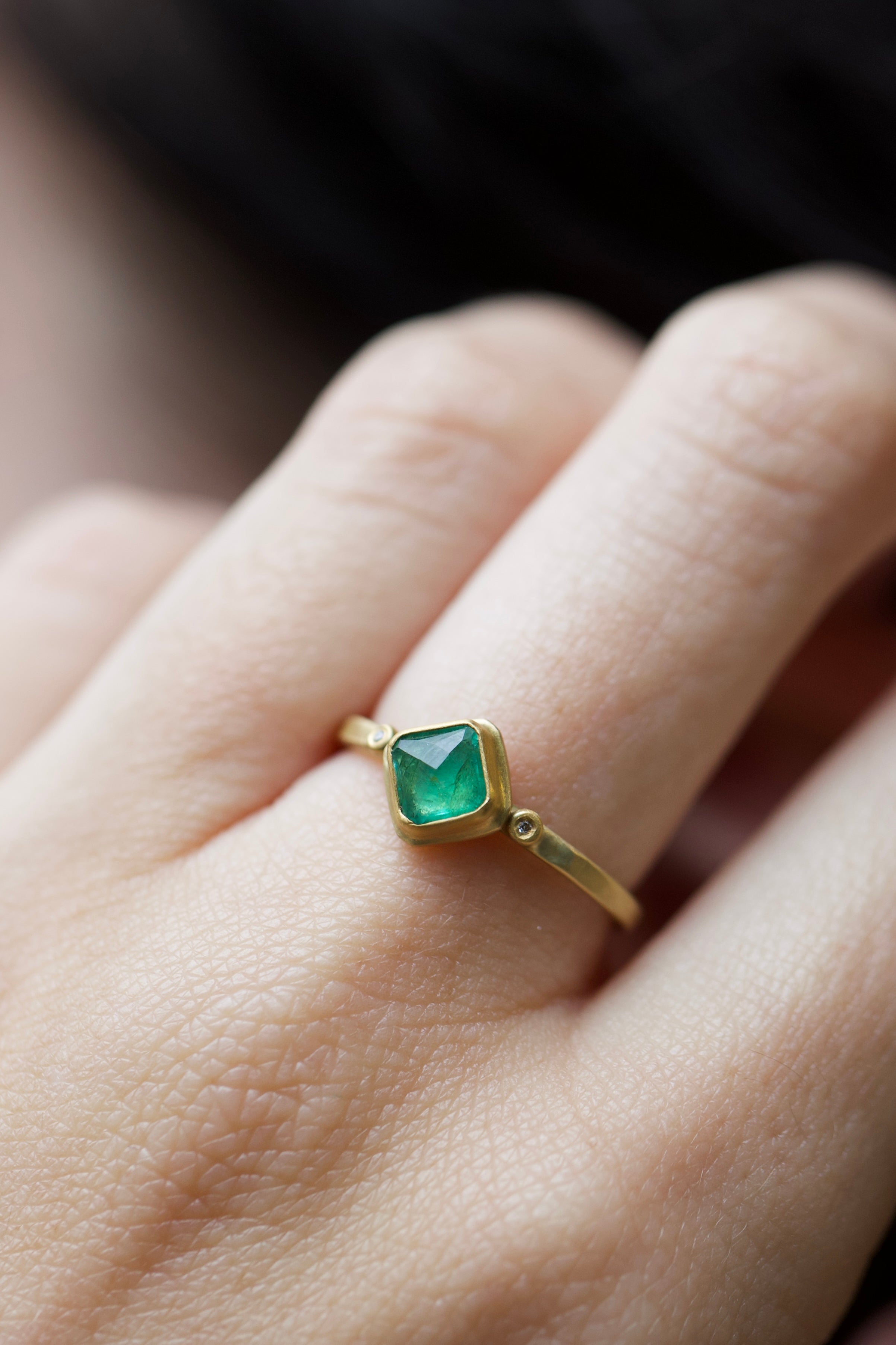 Image of a woman wearing the Ananda Khalsa Rosecut Emerald Ring