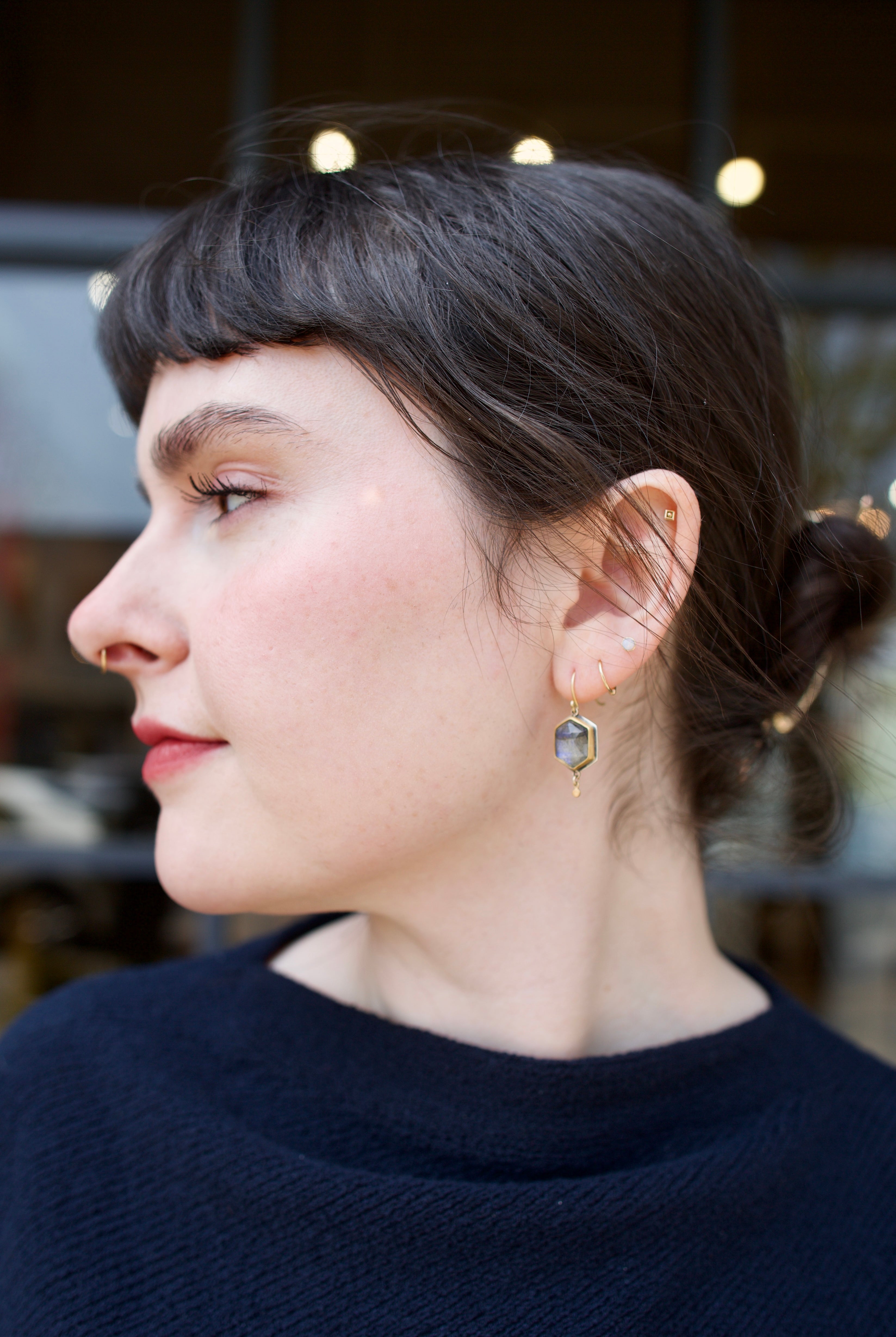 Image of woman wearing Ananda Khalsa handcrafted Rosecut Labradorite Hexagon gold Drop Earrings expertly designed