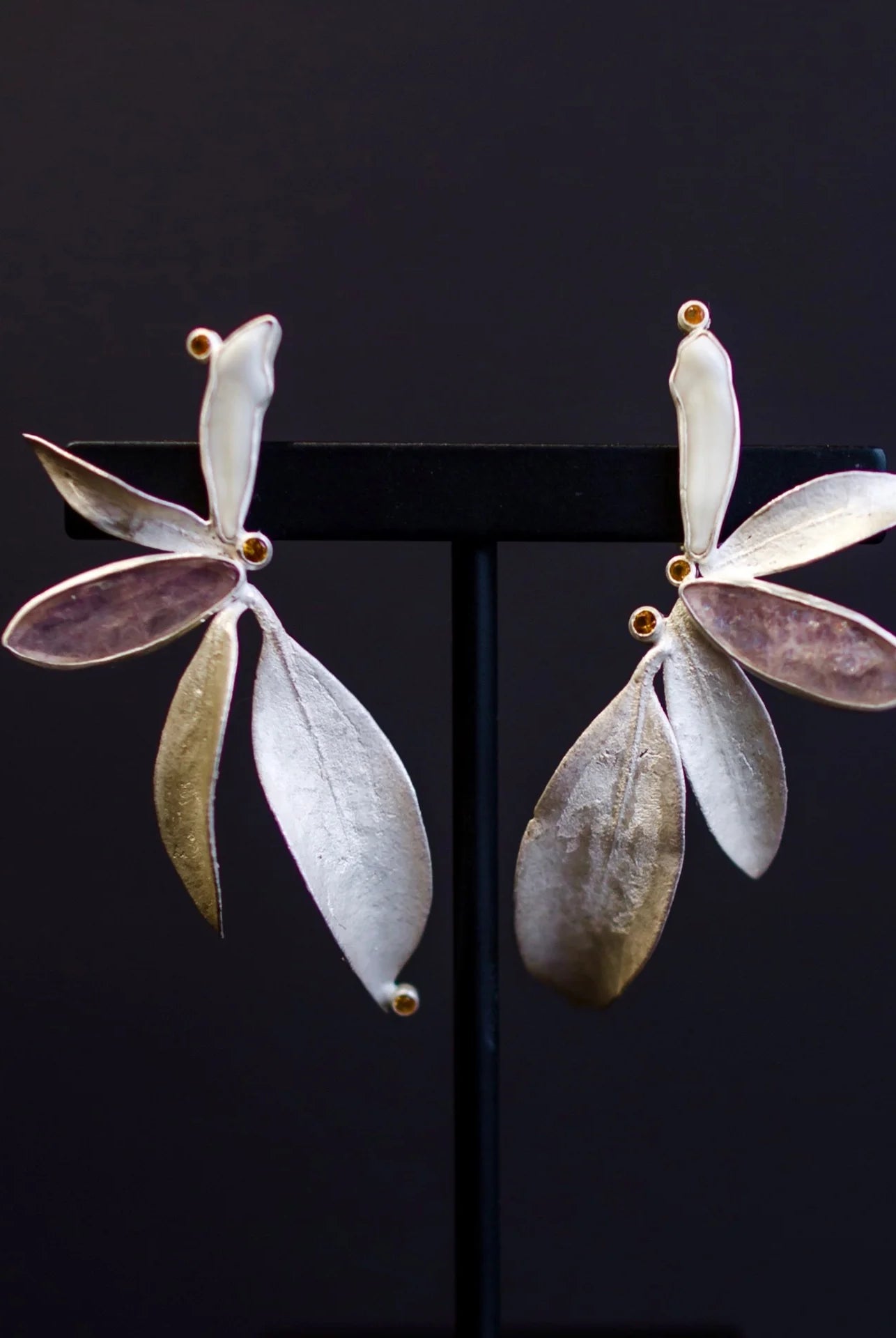 Image featuring North Carolina artist and jeweler Anna Johnson Kalmia Earrings with Teeth, cherry moonstone, topaz, depletion gilded silver, mountain laurel