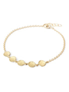 Image featuring bracelet by artist Anne Sportun fabricated in 18k yellow gold with 5 hammered gold discs