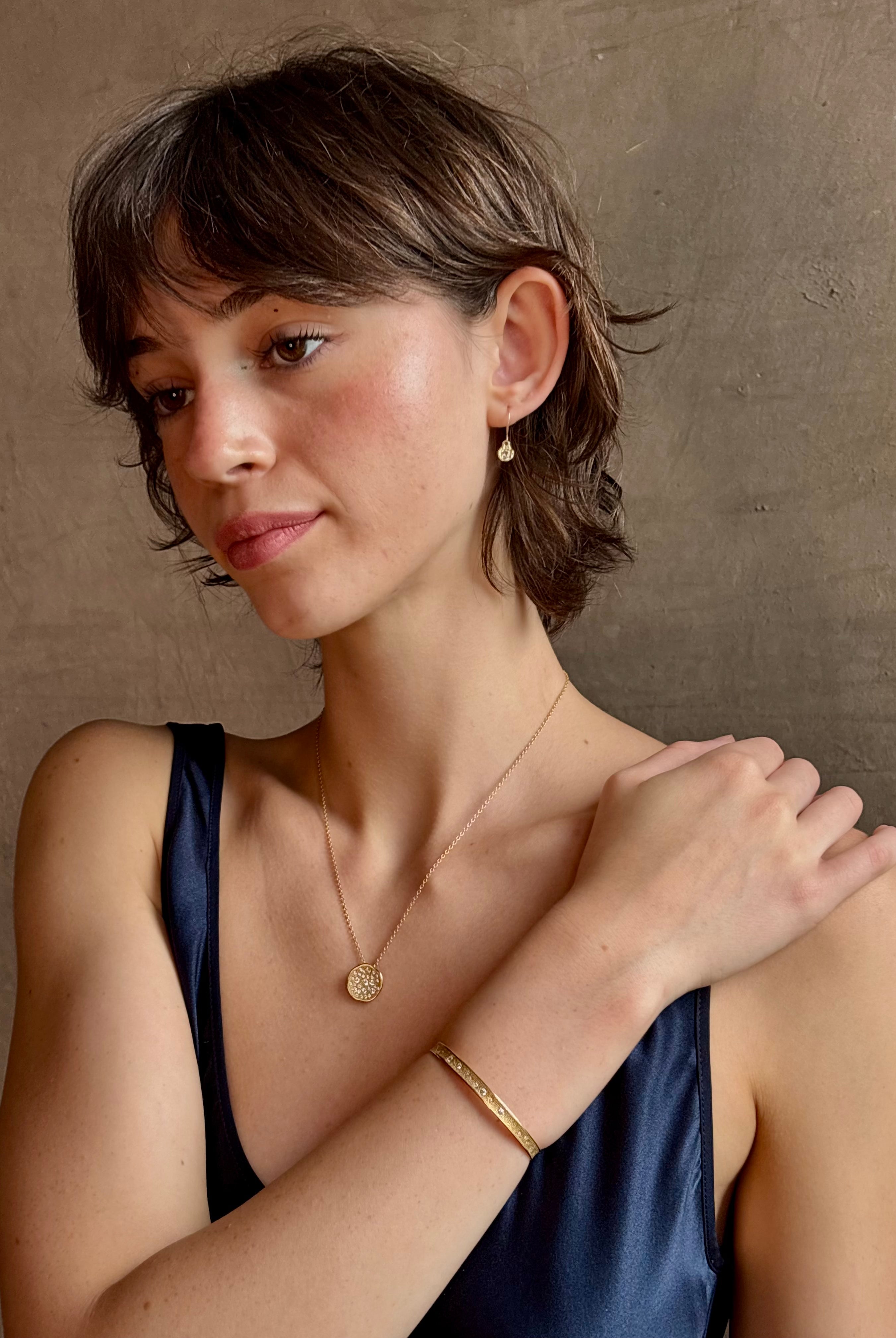 18k yellow gold diamond cuff by fine jewelry artist Anne Sportun with 31 round brilliant cut G/VS diamonds