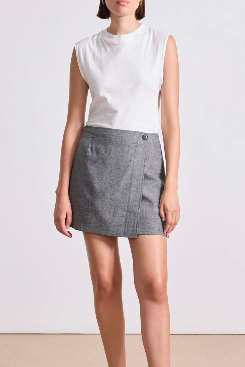 Model wearing Apiece Apart Marta mini skirt in sophisticated neutral heathered grey in virgin wool