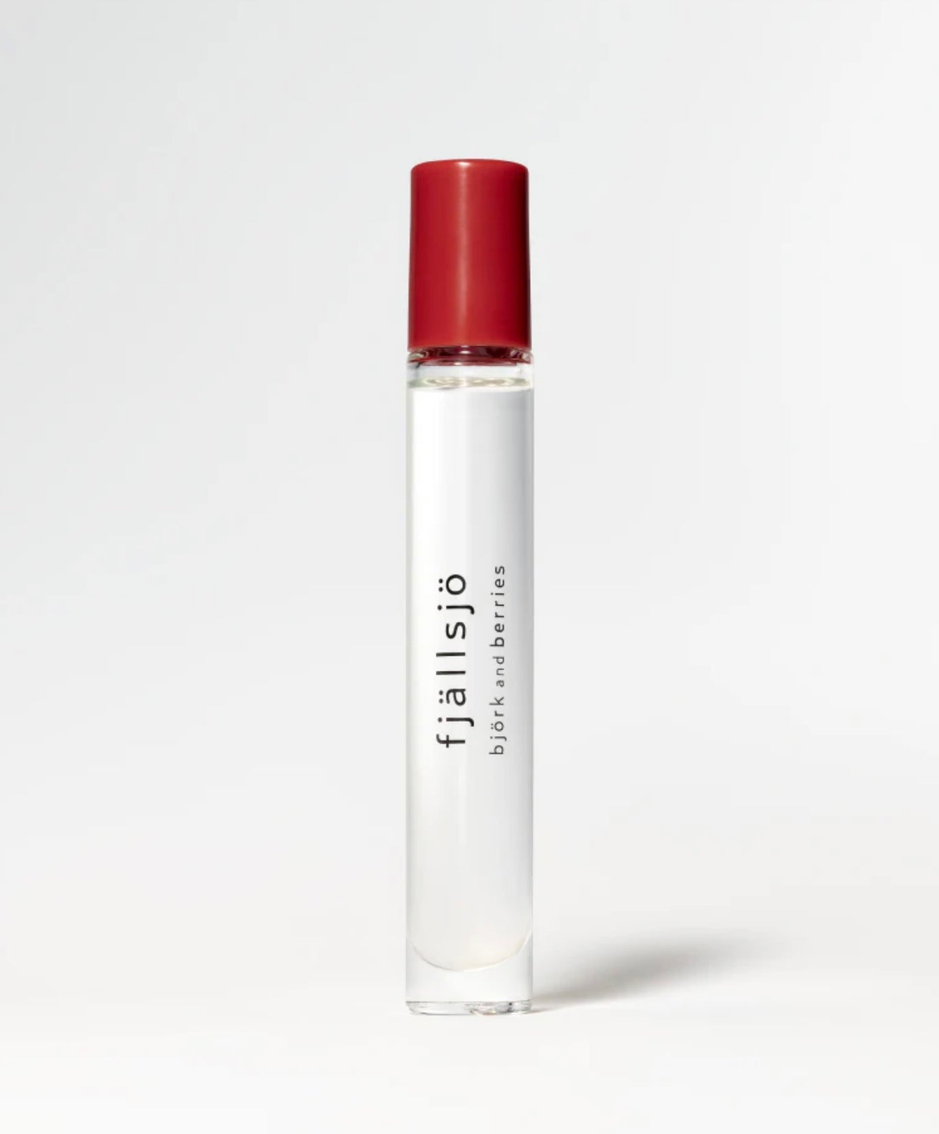 Image of BJORK AND BERRIES Fjallsjo luxury personal fragrance perfume oil with notes of Ambrette, Magnolia and Musk in a Scandinavian minimalist design clear glass bottle and red lid