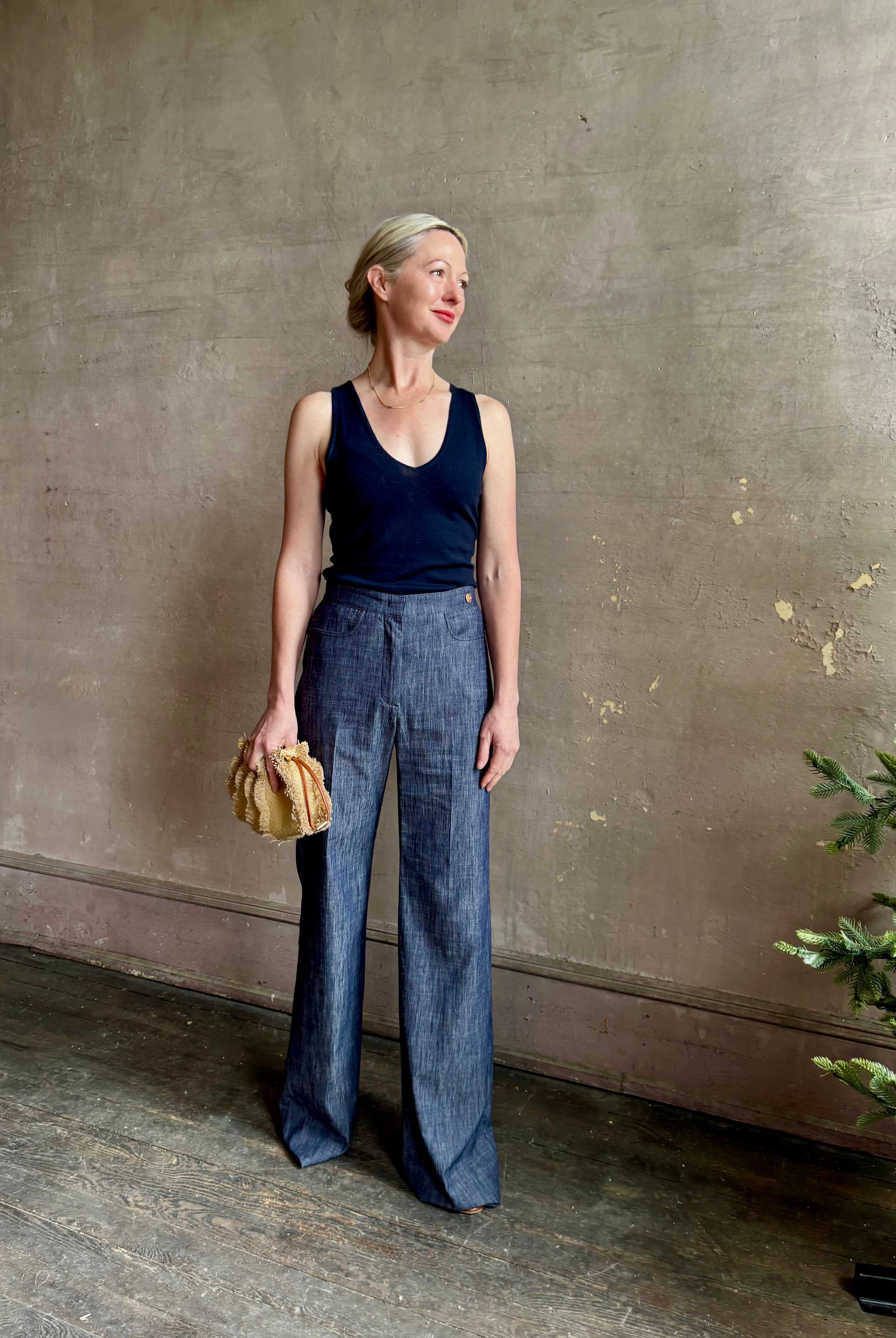 Mature woman wearing Italian designer Tonne trouser from Callas rendered in a dark indigo and crafted from a viscose, polyester, and linen blend with beautiful fluid draping and effortless versitility similar to denim