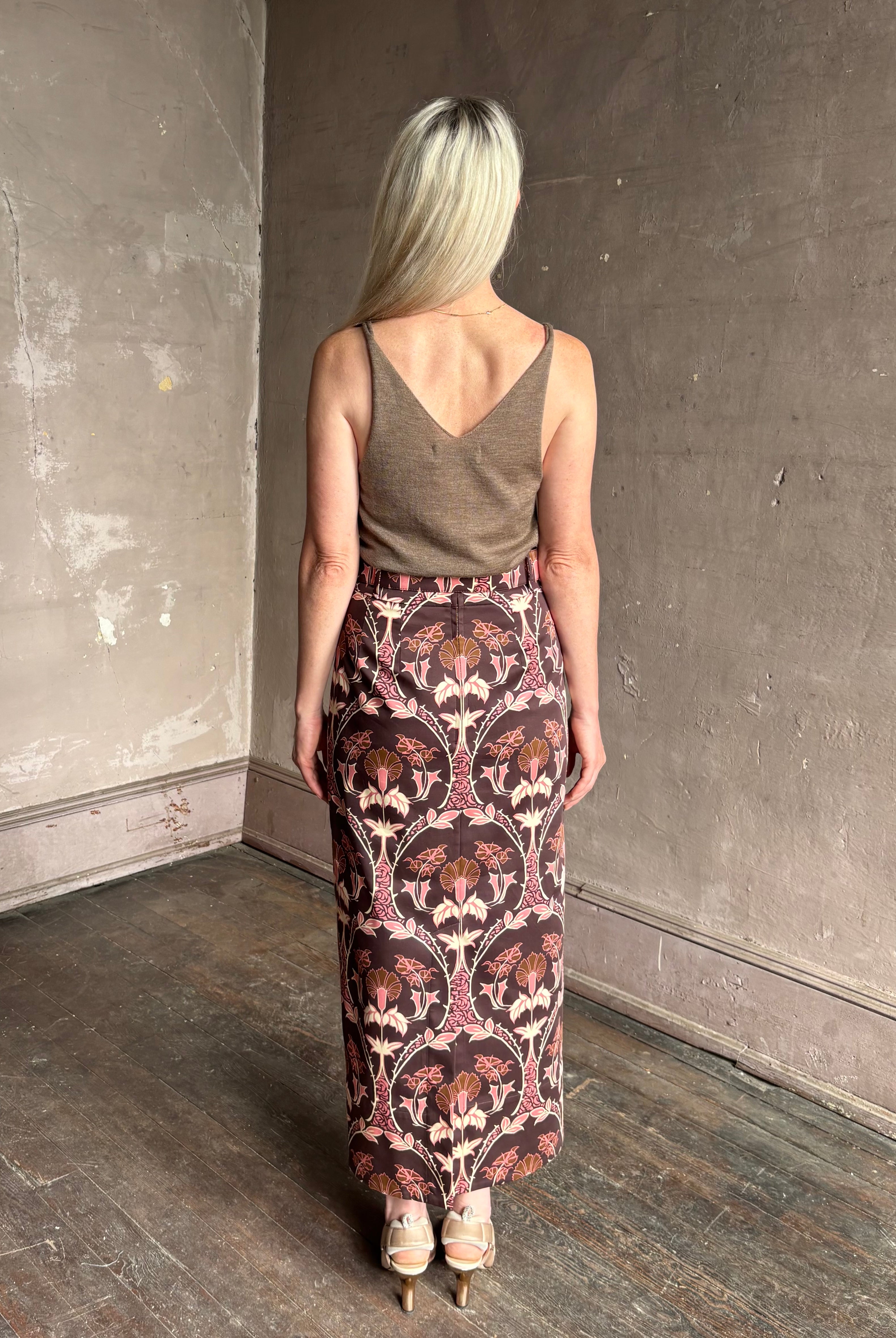 Mature woman wearing Cara Cara blaze long pencil skirt with a brown pink and beige botanical damask pattern