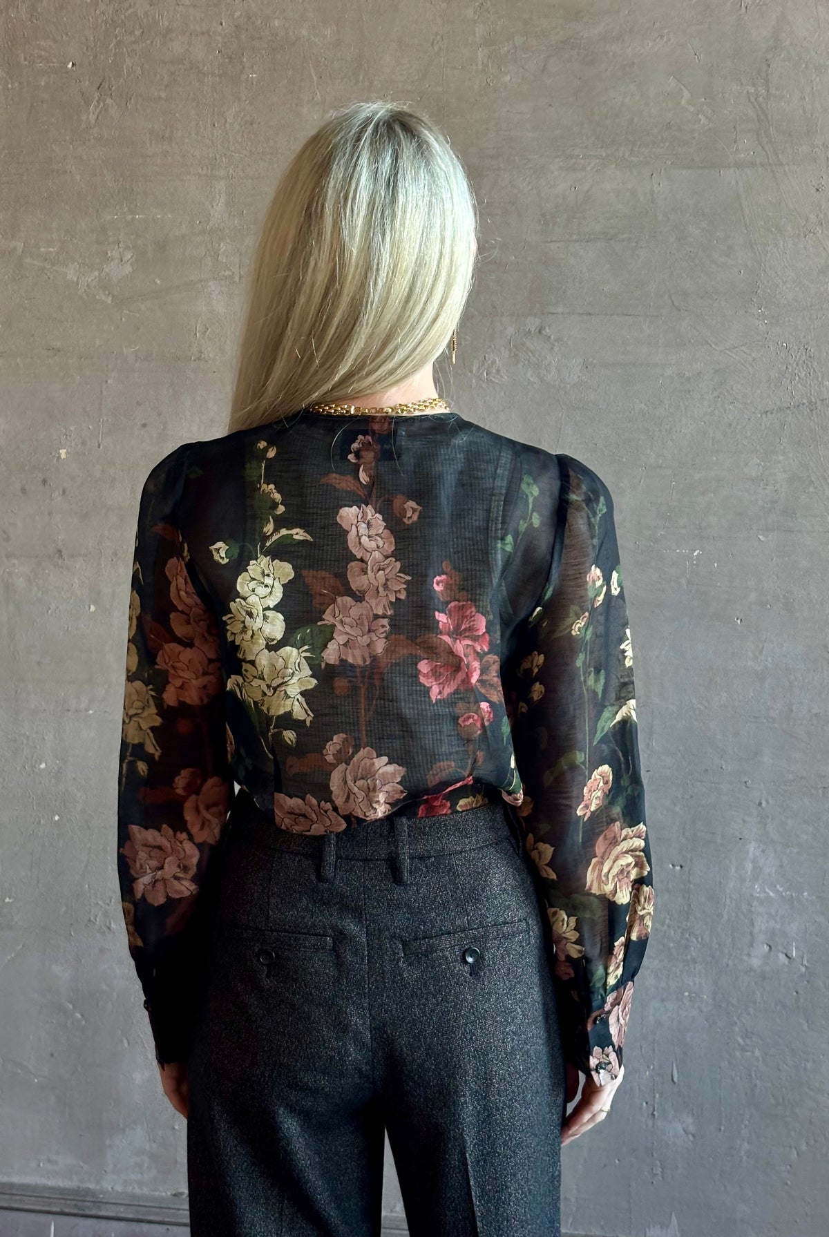 Mature woman wearing Cara Cara Chili Blouse in Meadows Black linen-silk crystal buttons Romantic dressmaker-quality statement blouse