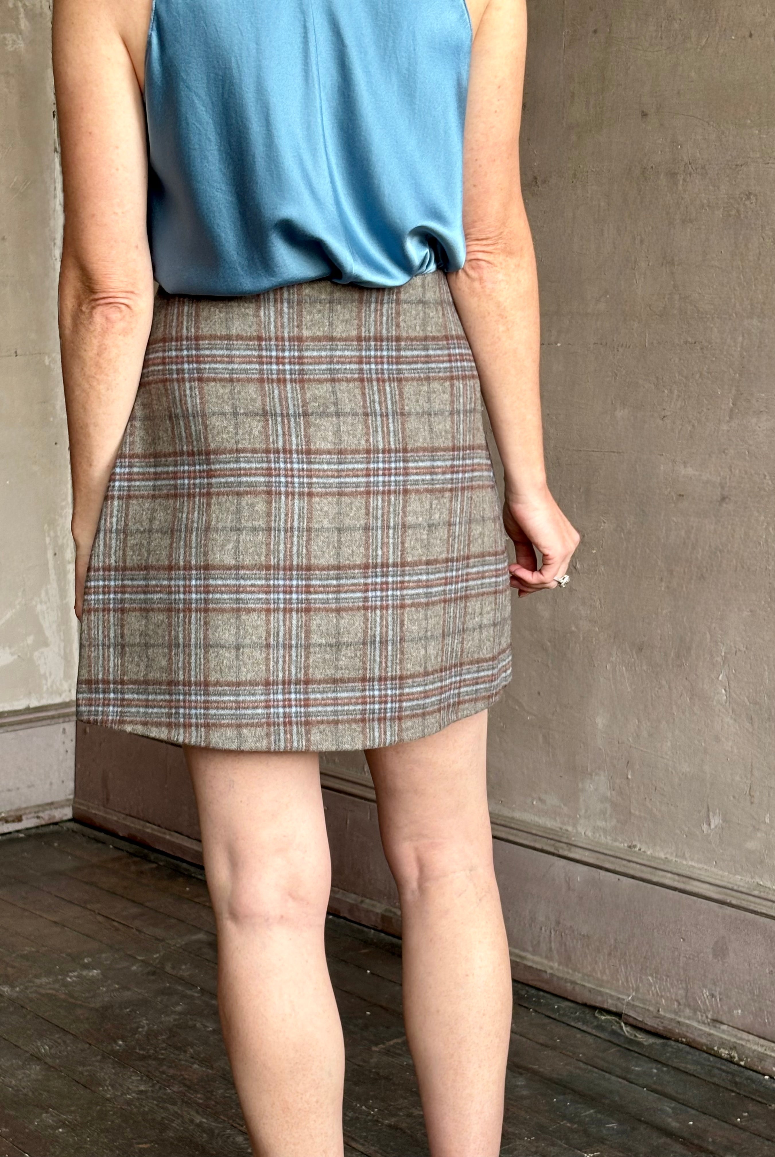 Image of woman wearing the classic Allen Plaid A-Line Mini Skirt from Cara Cara in a premium wool blend