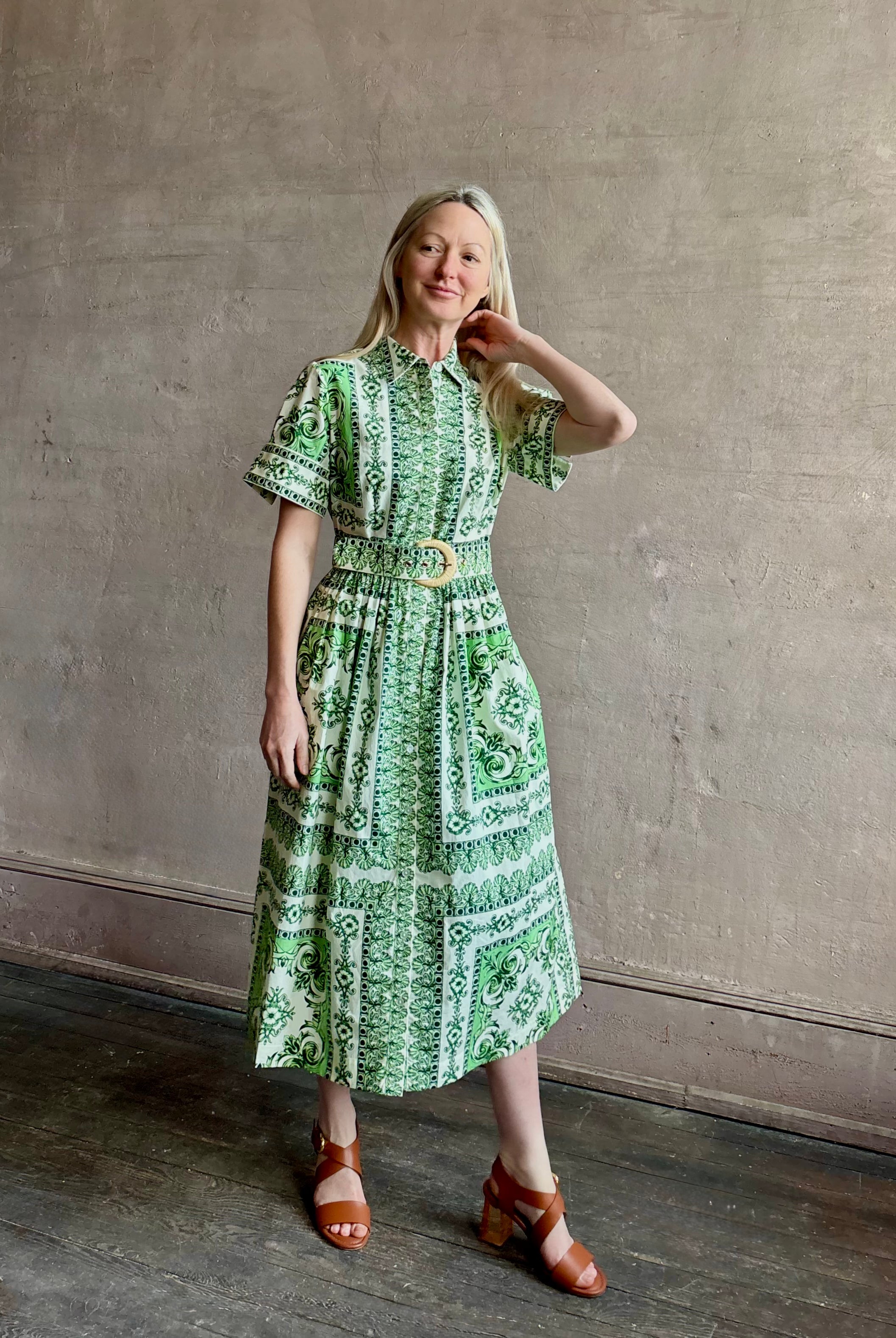 Woman wearing Cara Cara designer Malena cotton poplin shirt dress in a green Hudson Scarf Mint print with short sleeves ad belt