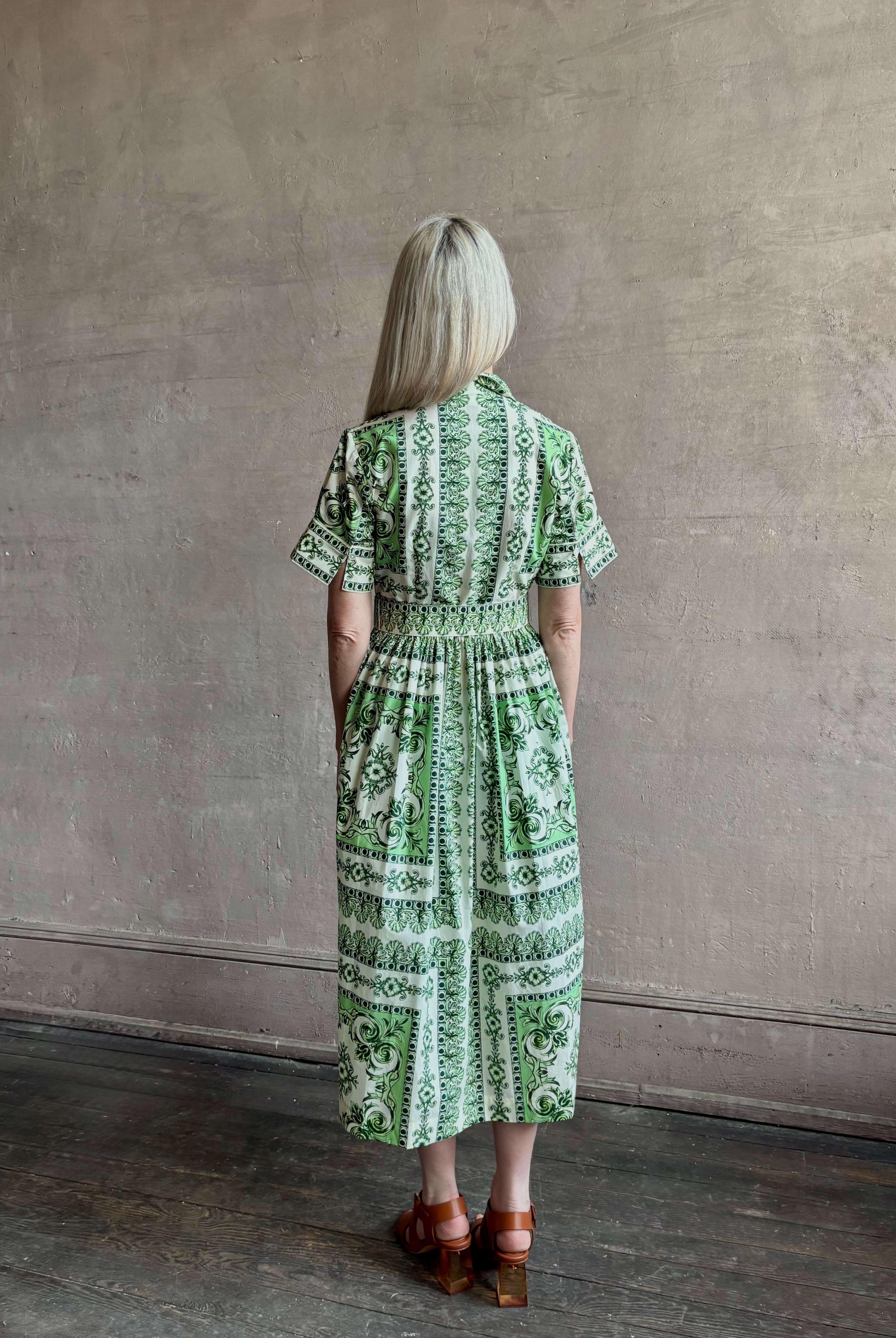 Woman wearing Cara Cara designer Malena cotton poplin shirt dress in a green Hudson Scarf Mint print with short sleeves ad belt