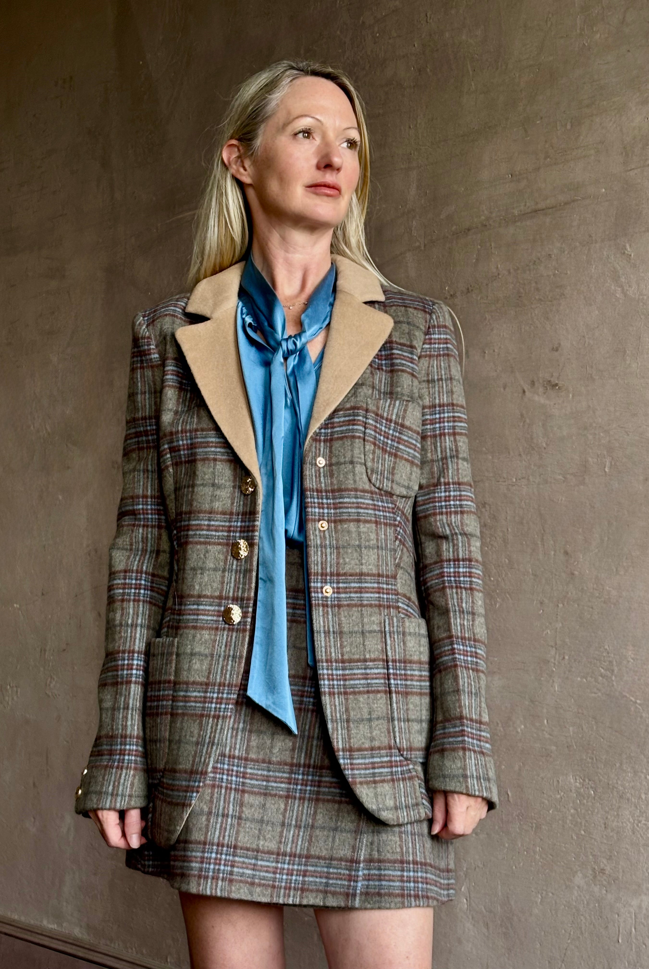 Image of woman wearing the Cara Cara Ross classic tailored Ross blazer with coordinating kitty mini skirt can be worn as a matching set