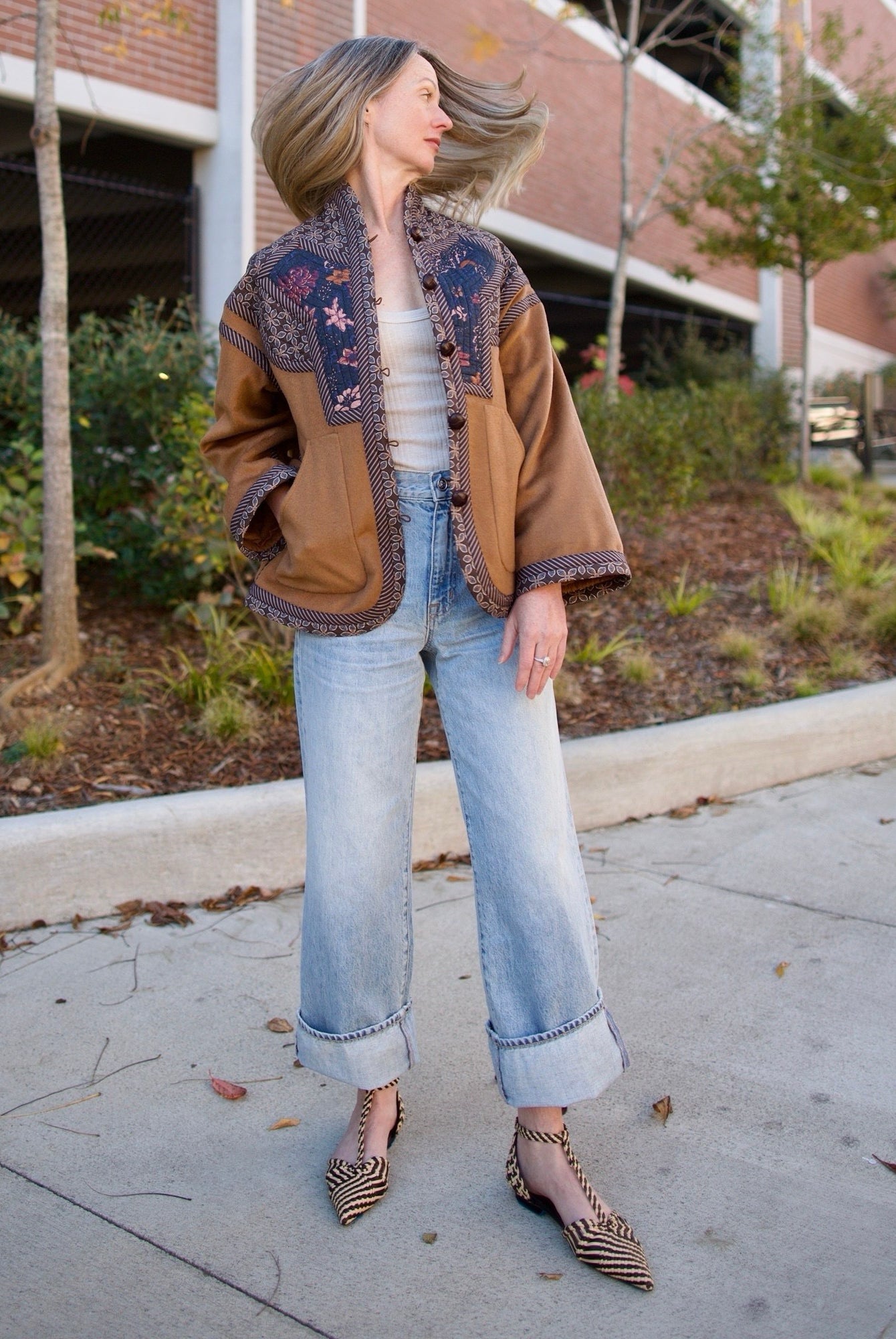 Image of a woman wearing the Cara Cara Ford Jacket, Enza Costa Ribbed Tank, Ulla Johnson Daria Flats and the slvrlake grace jeans