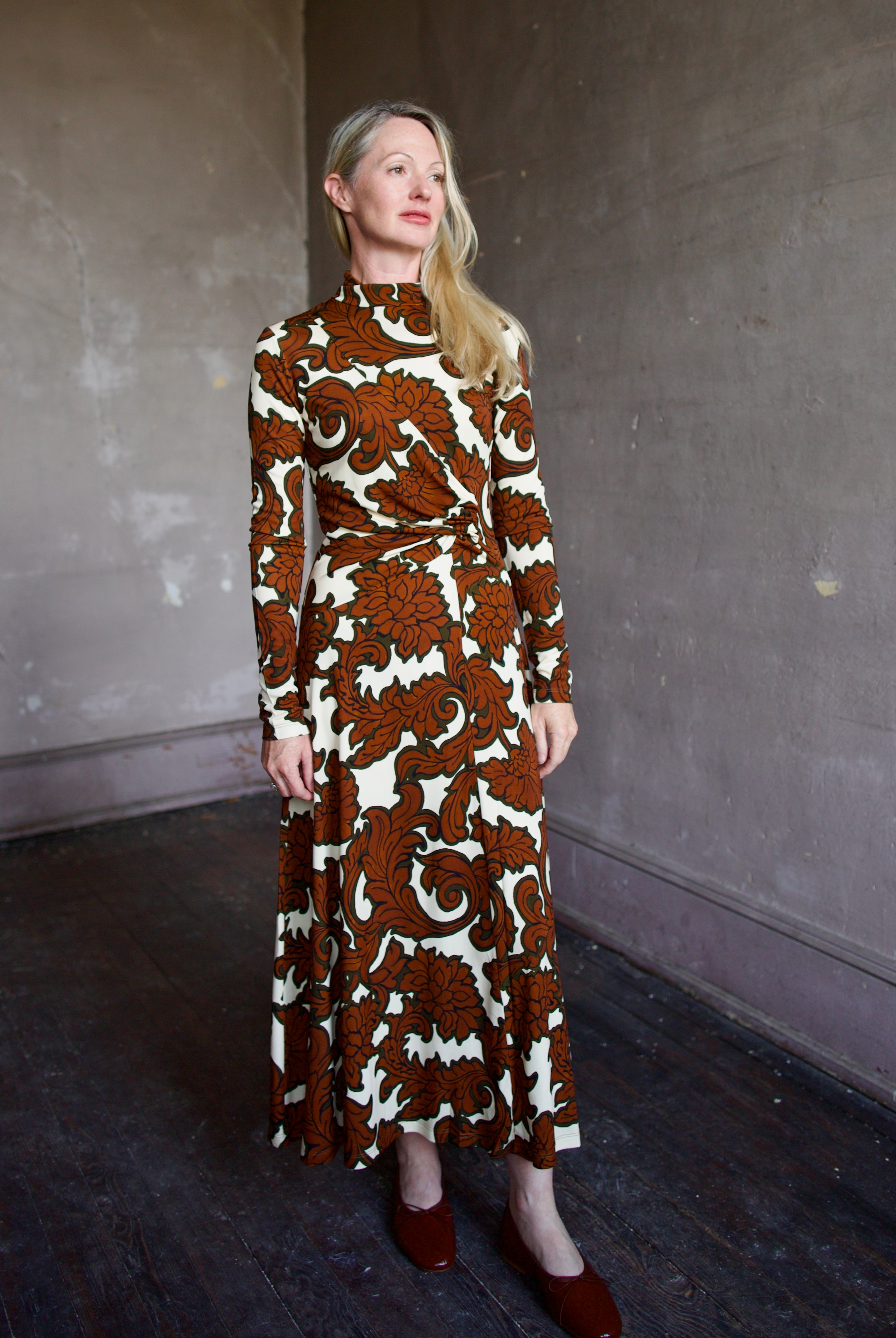 Model wearing the sophisticated patterned Hera dress by Cara Cara with a flattering A-line silhouette