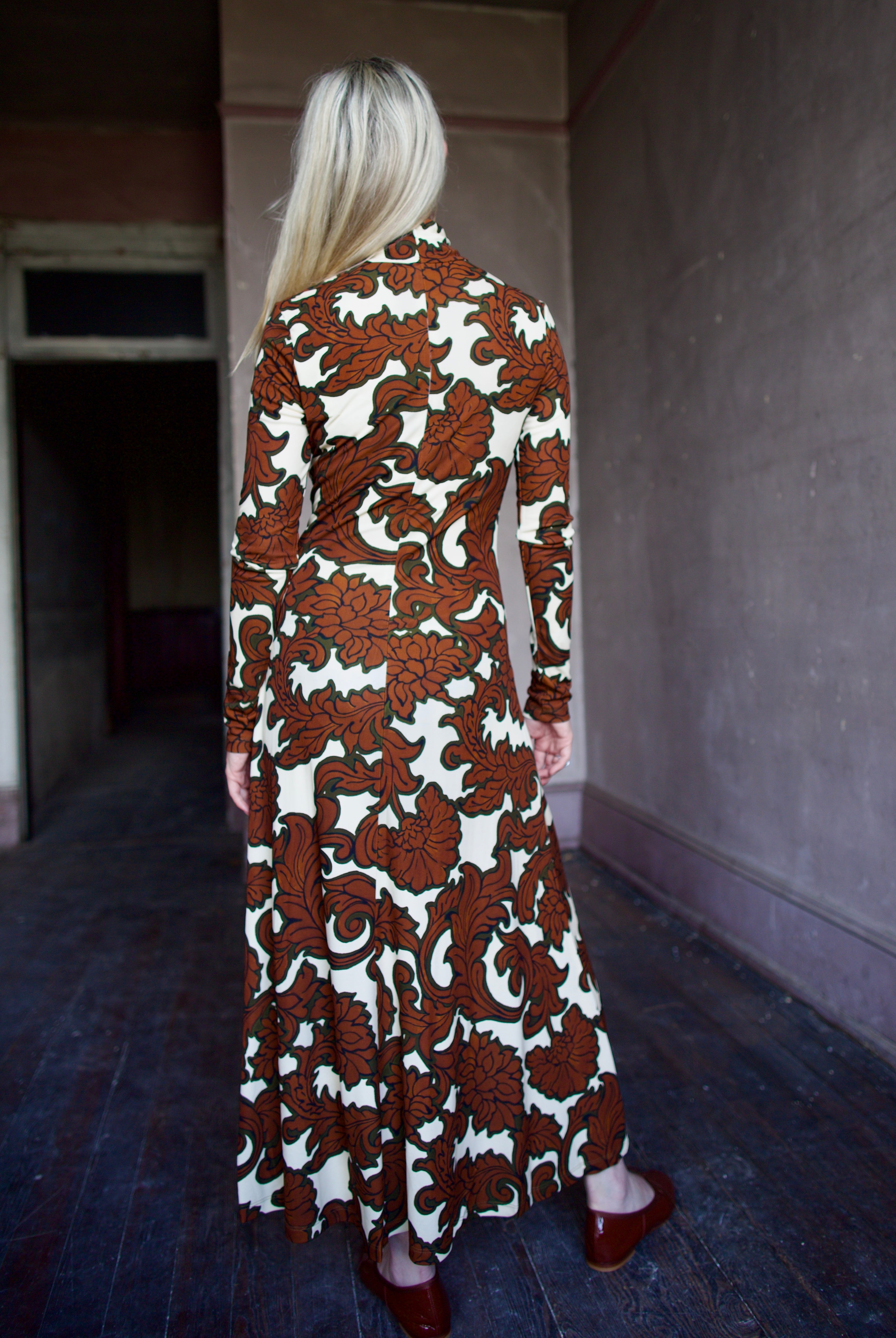 Model wearing the sophisticated patterned Hera dress by Cara Cara with a flattering A-line silhouette