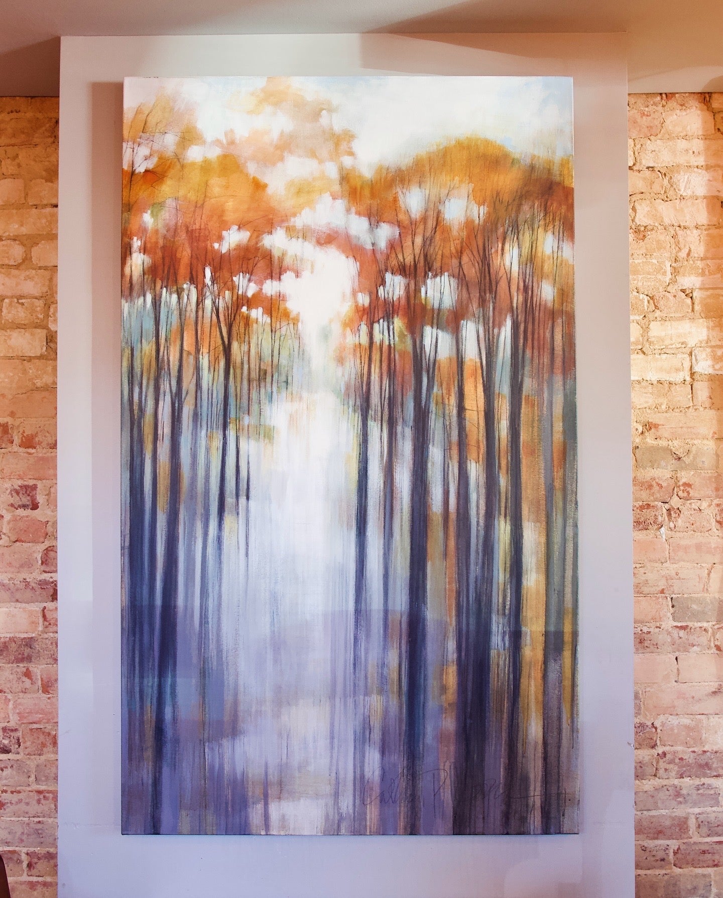 A canvas painting titled 'Autumn Rain II' by North Carolina artist Cathryn Cooper, featuring a forest scene with a blend of acrylic and graphite, in autumnal colors.