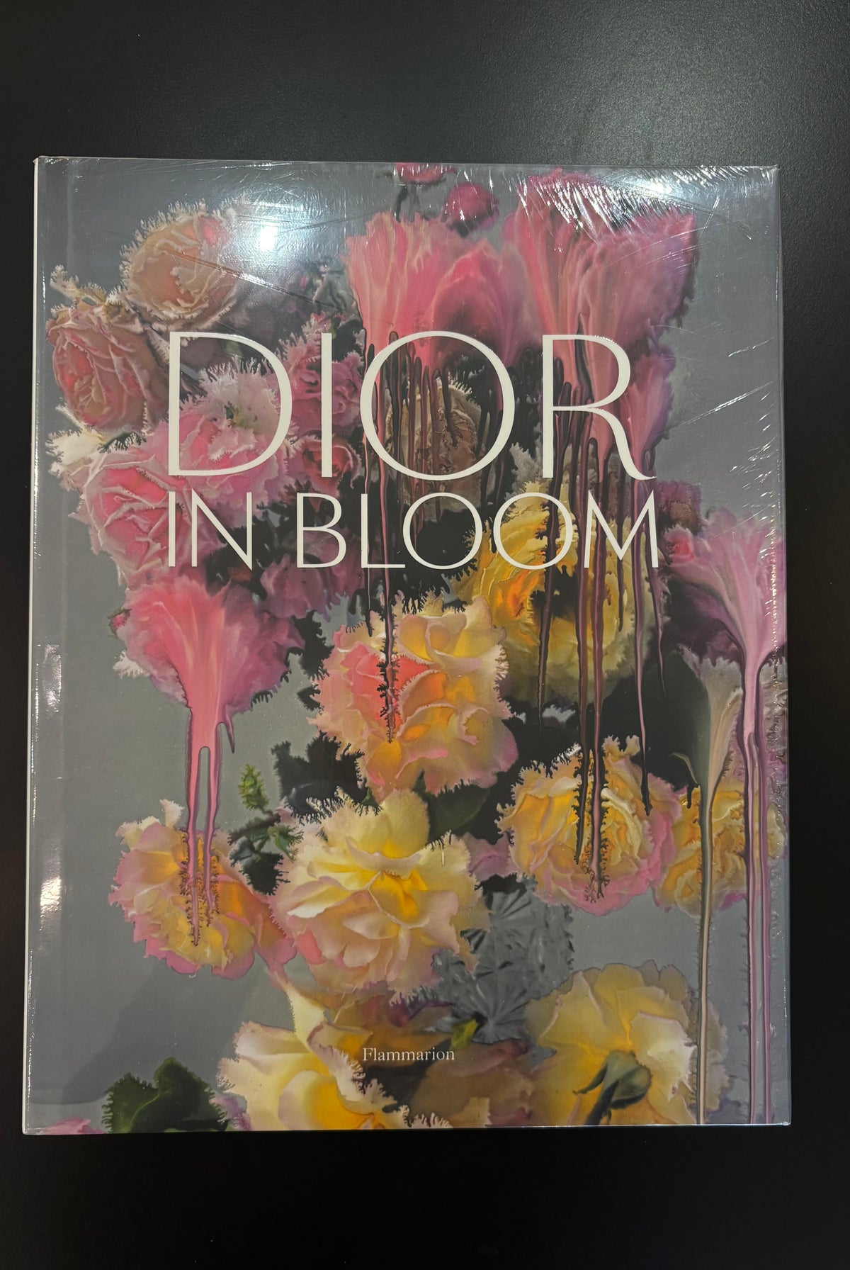 Dior in Bloom: a large-format hardcover tracing eight decades of floral inspiration at the House of Dior. Archival sketches, embroidery details, and Nick Knight rose portraits.