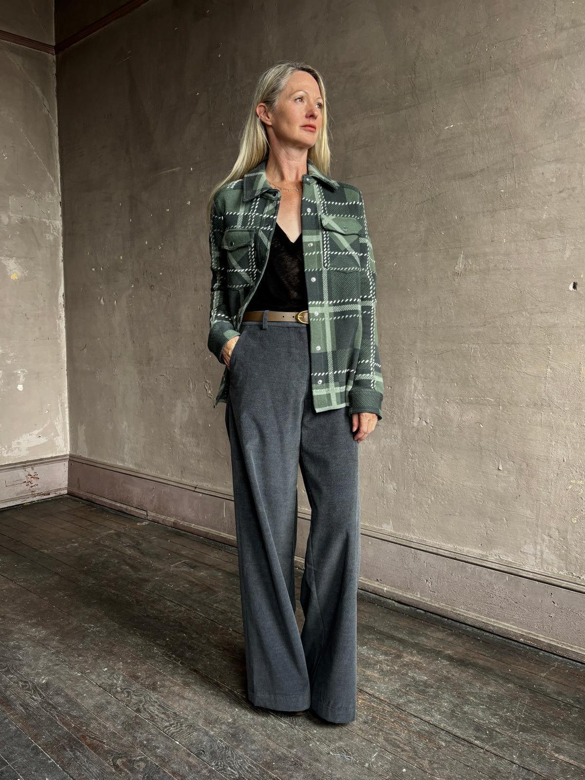 TWP’s Ranchers Cardigan in Grey Green Multi: a 100% cashmere plaid shacket with a button front. Cloud-soft, mountain-inspired layering.