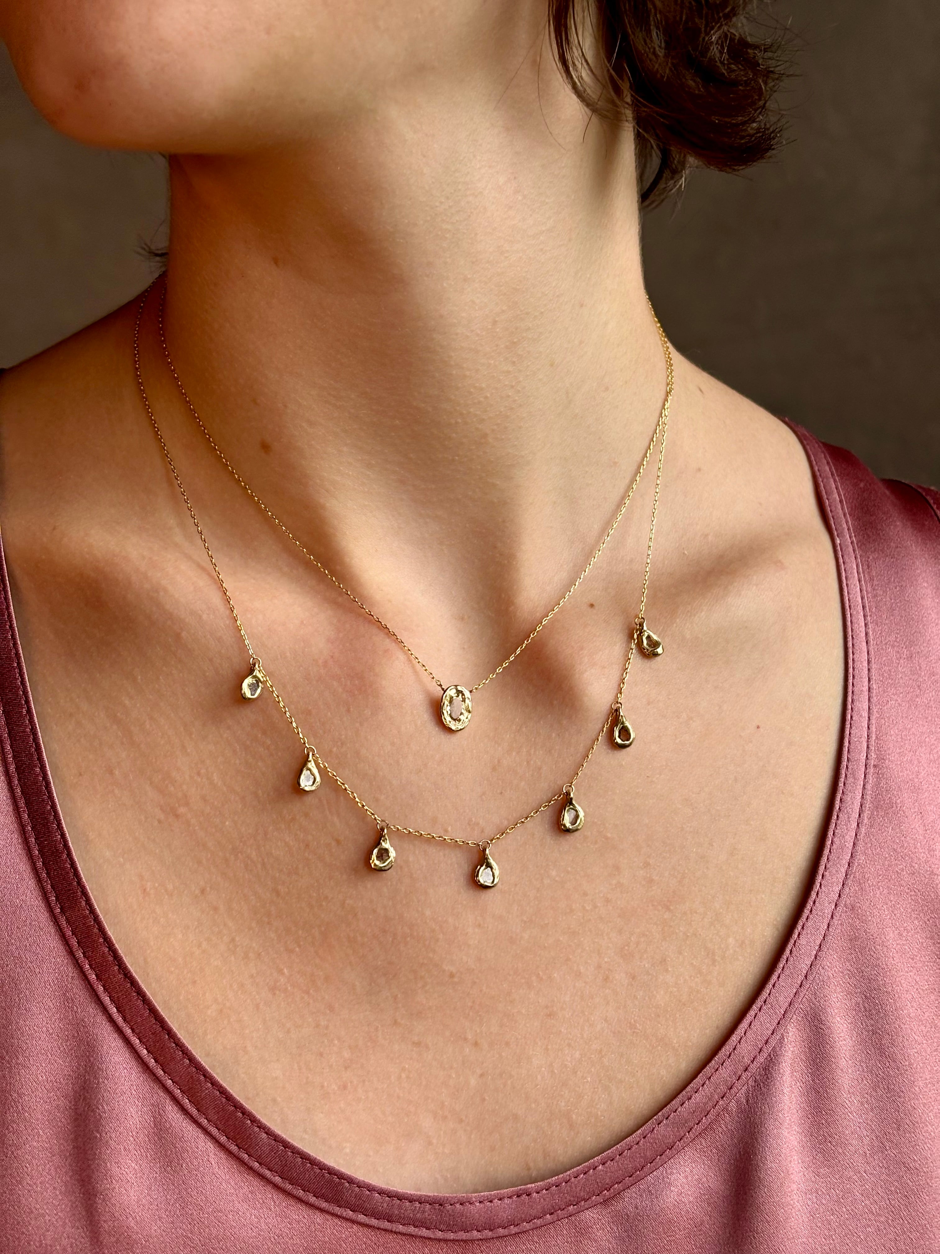 Woman wearing White Sapphire Pendant Necklace from fine jewelry designer Emilie Shapiro exquisitely handcrafted in USA and sustainably considered 14K yellow gold