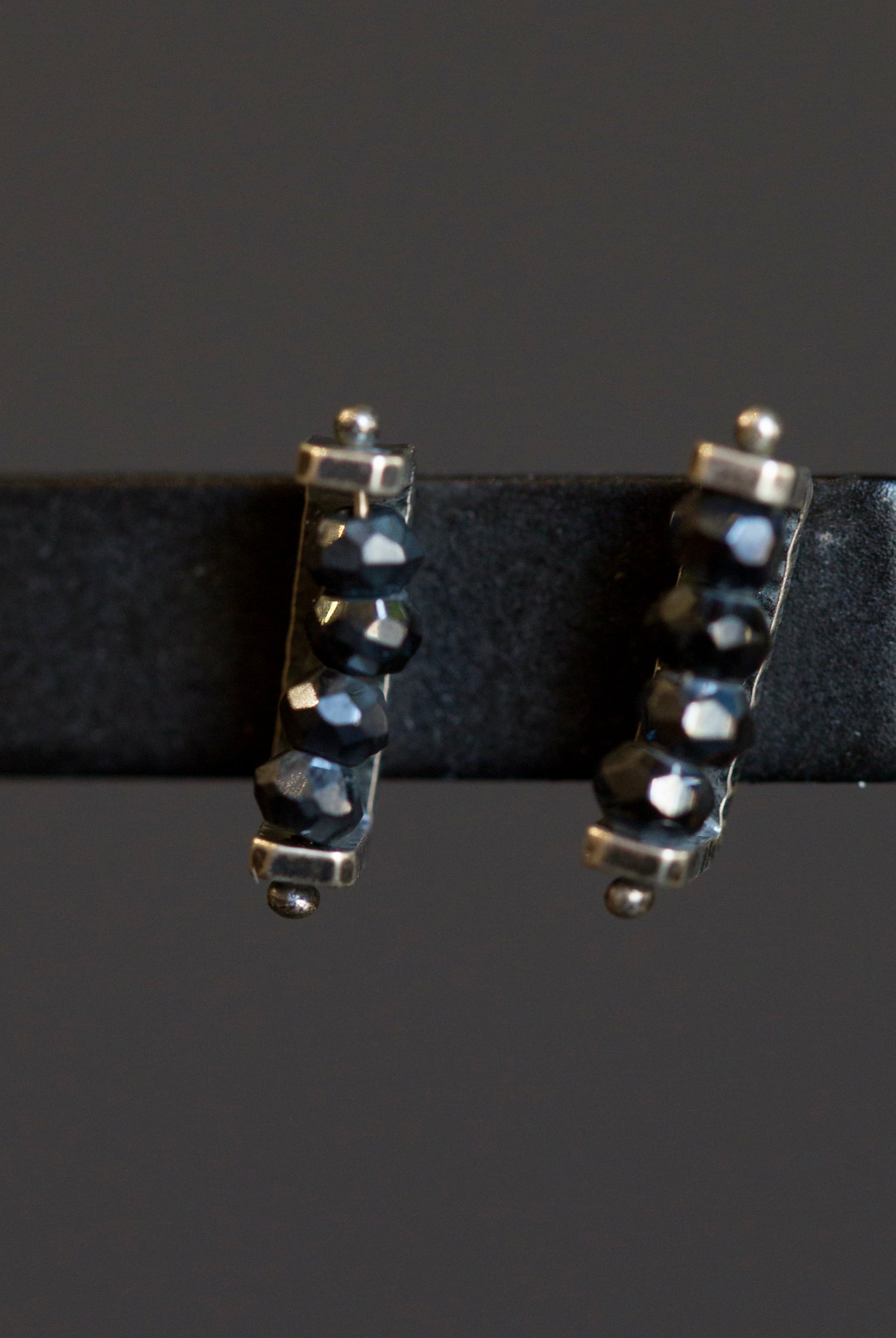 Image of sterling silver and black spinel linear Stud Earrings from fine jewelry artist Erica Bailey hand crafted in USA