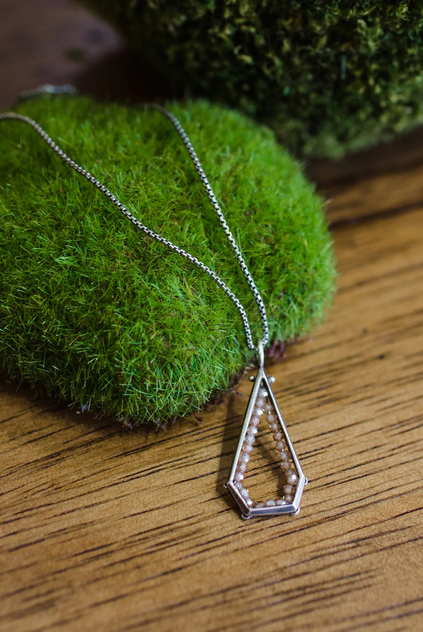 Image of a sterling silver and champagne zircon geometric hexagon pendant necklace by North Carolina jewelry artist Erica Bailey handmade in USA