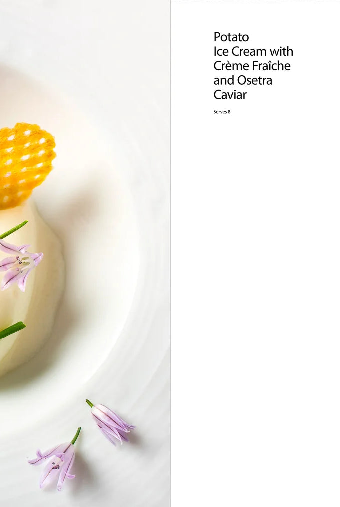Gourmet dessert with caviar and flowers on a white plate, accompanied by recipe on right from Eleven Madison Park