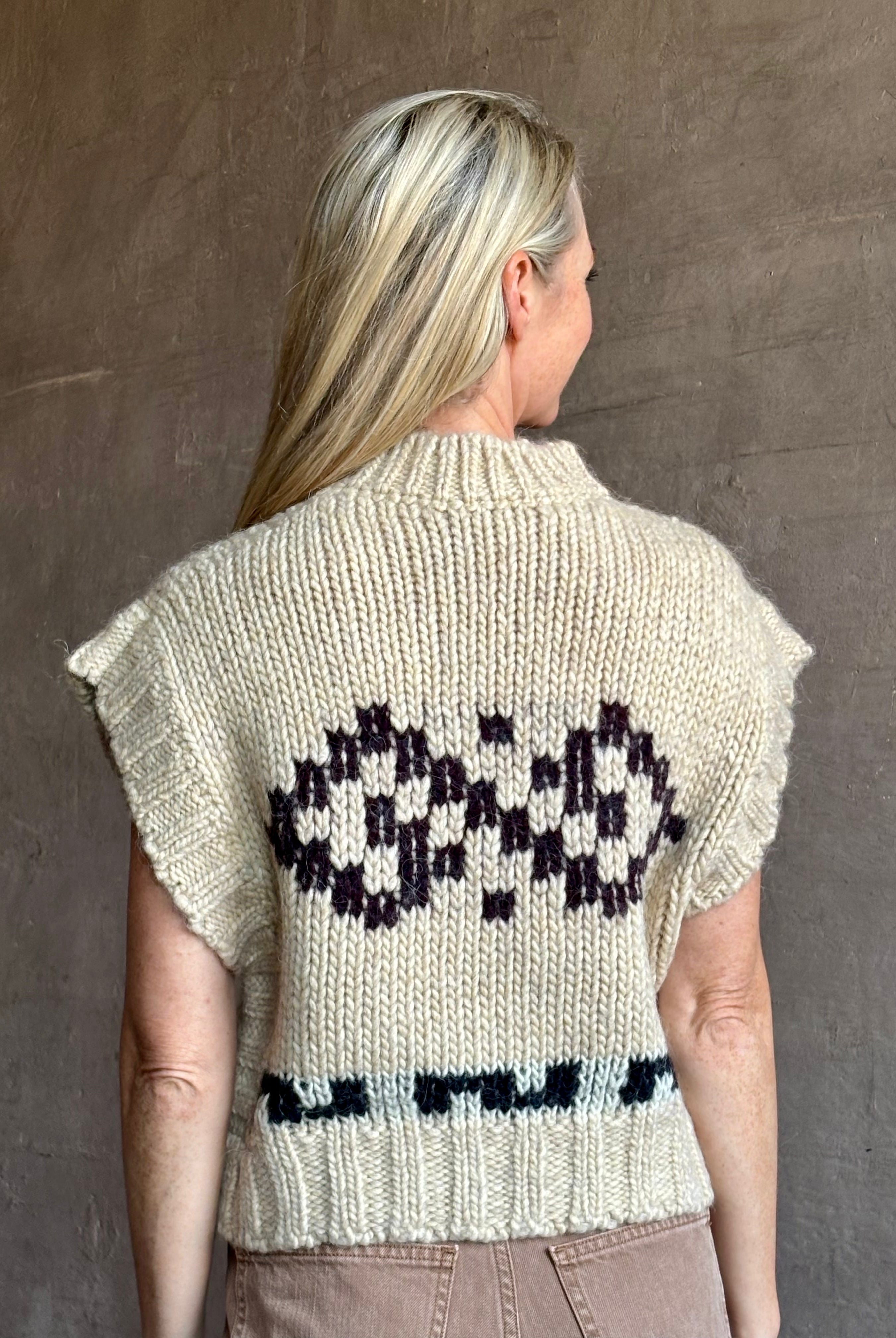 Image of mature woman wearing luxury Italian designer FORTE FORTE Attica Jacquard alpaca wool knit sweater Vest in Honey
