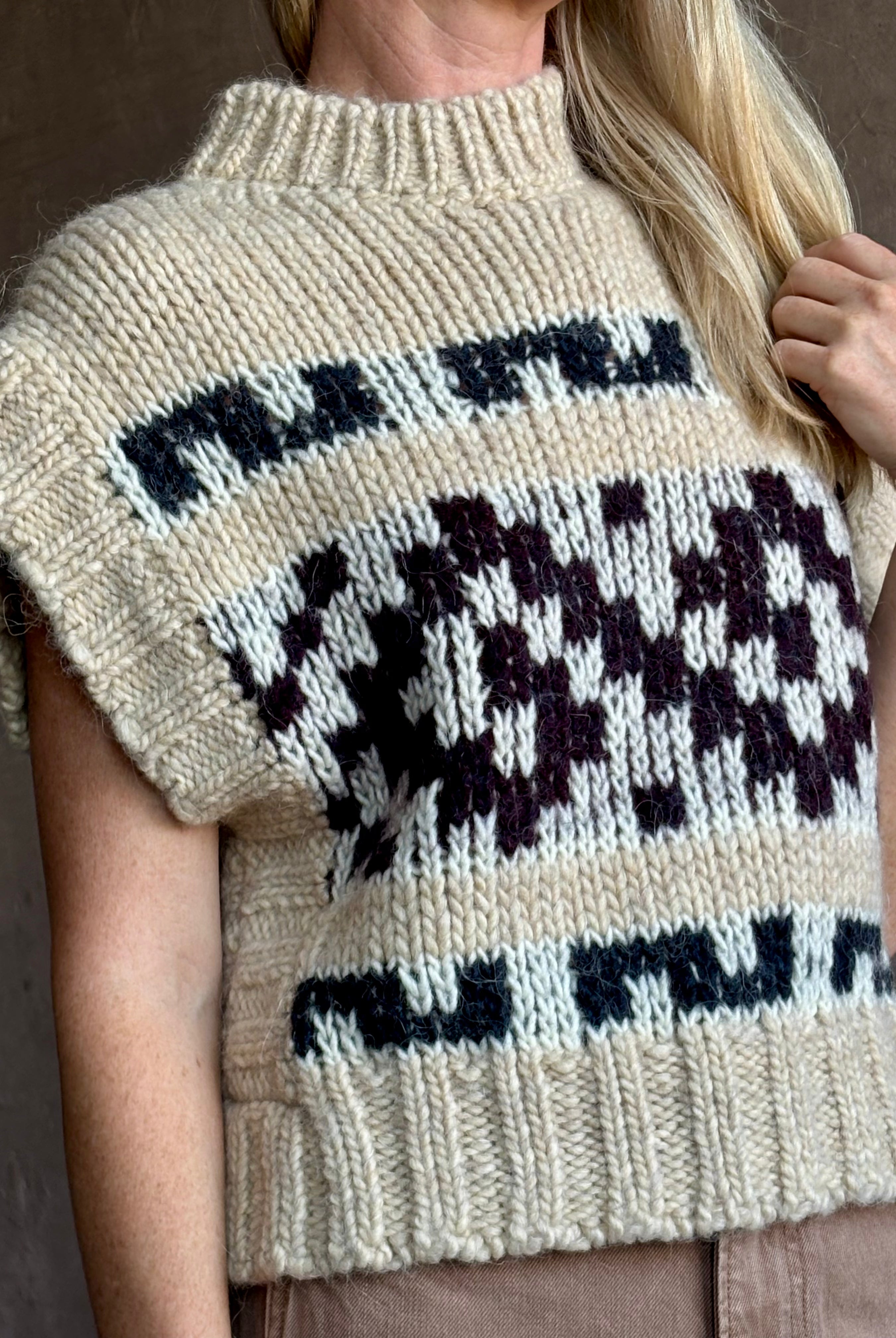 Image of mature woman wearing luxury Italian designer FORTE FORTE Attica Jacquard alpaca wool knit sweater Vest in Honey